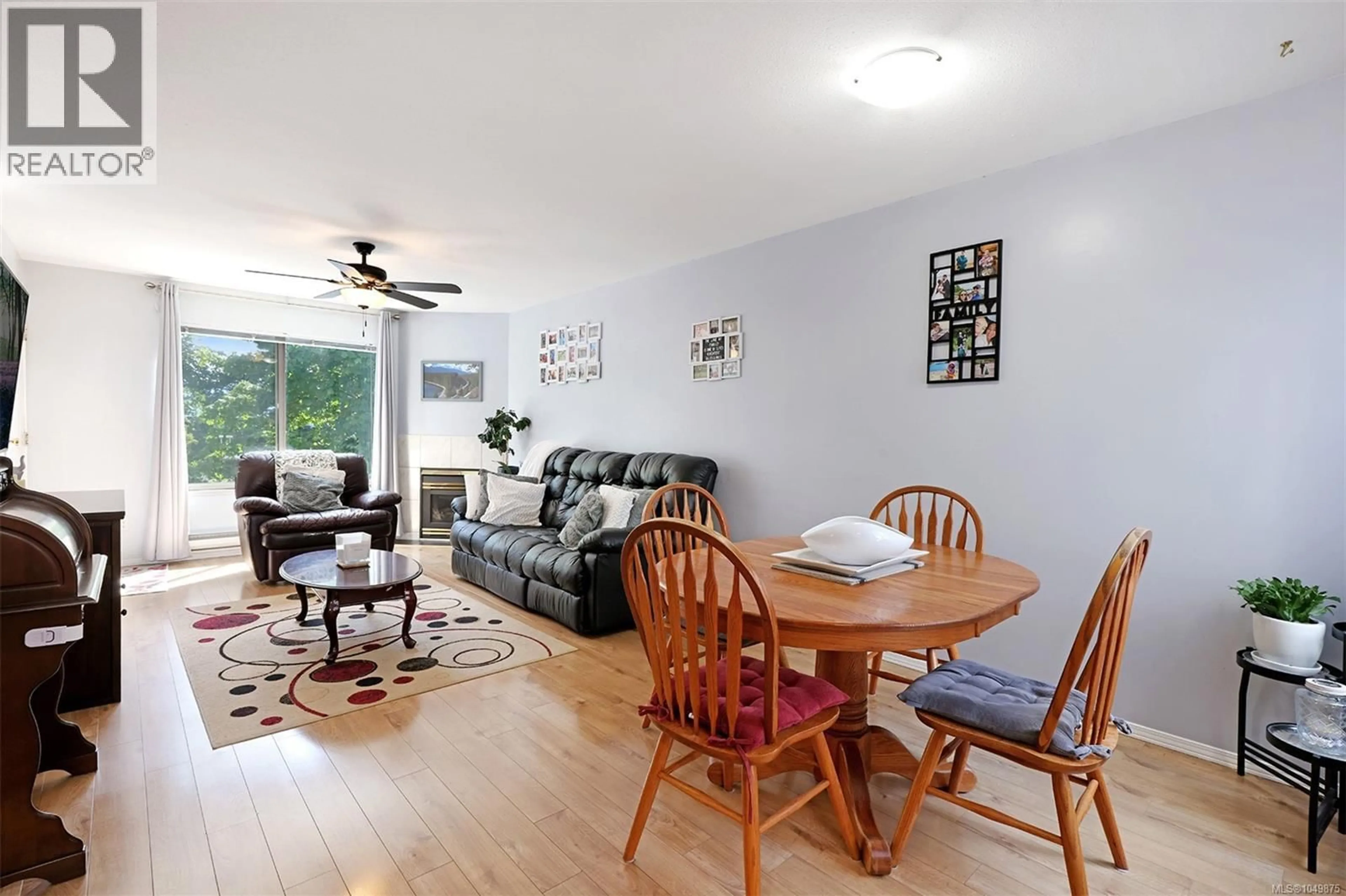 Living room with furniture, wood/laminate floor for 202 - 4685 ALDERWOOD PLACE, Courtenay British Columbia V9N9A1