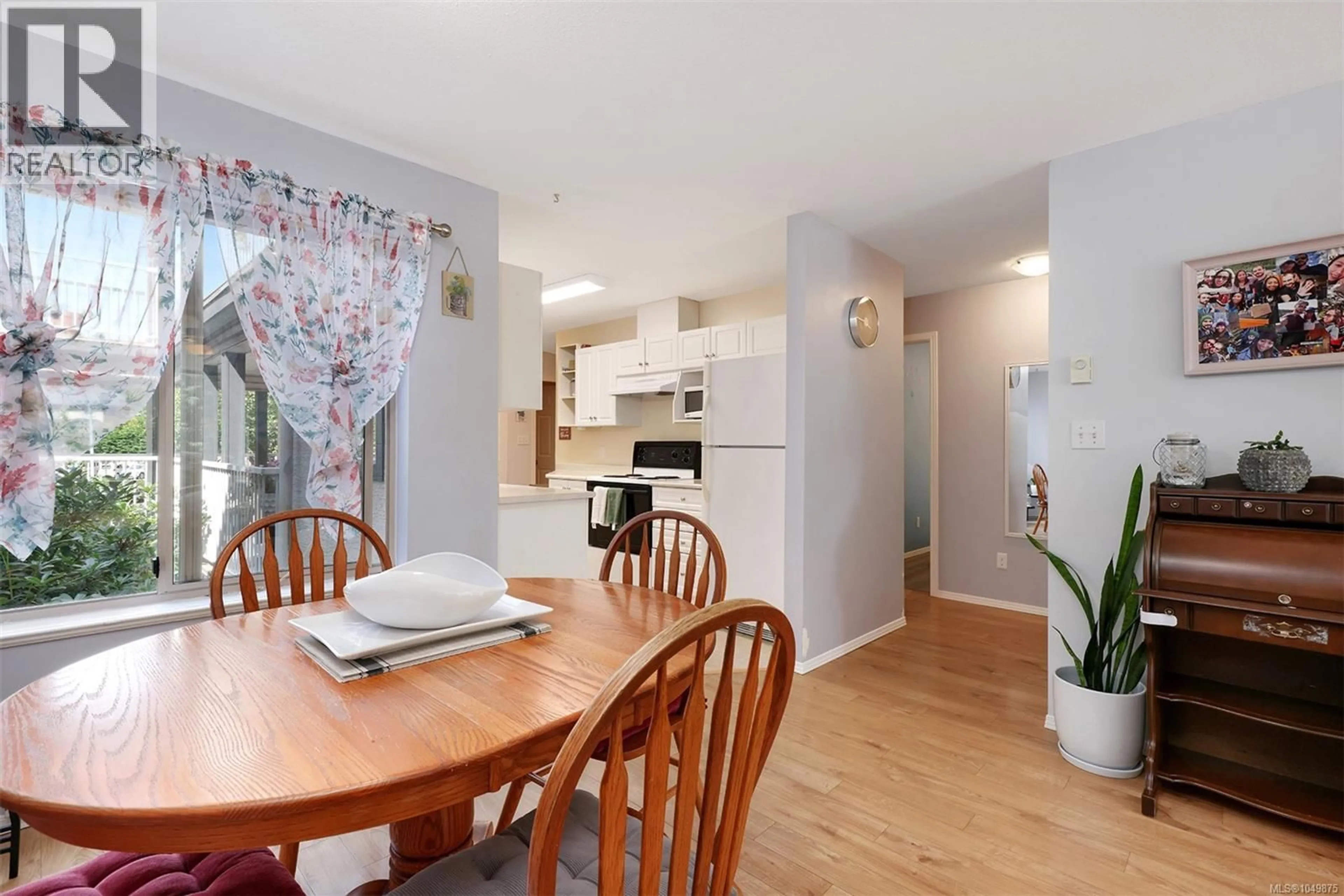 Open concept kitchen, wood/laminate floor for 202 - 4685 ALDERWOOD PLACE, Courtenay British Columbia V9N9A1