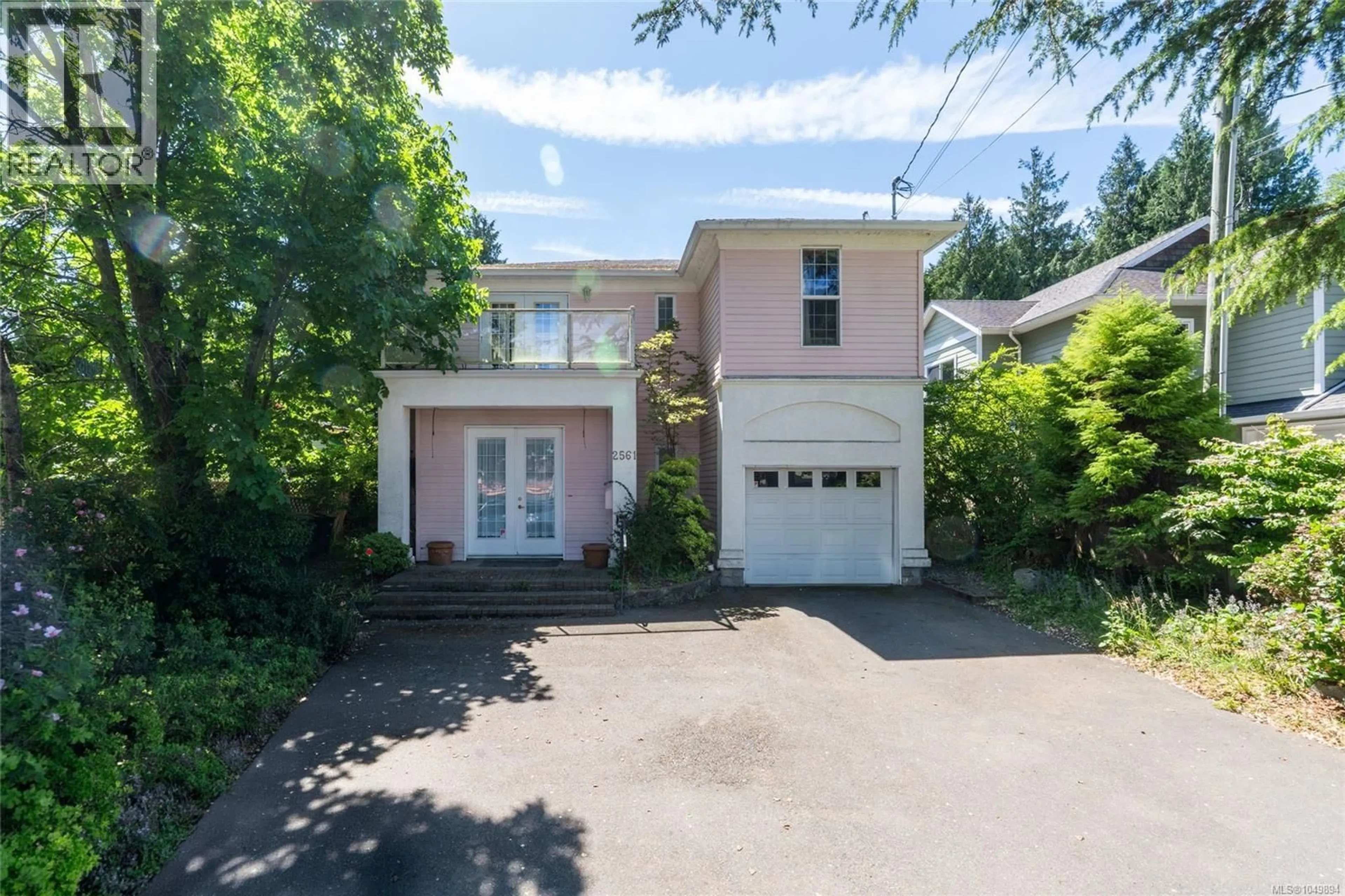 A pic from outside/outdoor area/front of a property/back of a property/a pic from drone, street for 2561 SINCLAIR ROAD, Saanich British Columbia V8N1B7