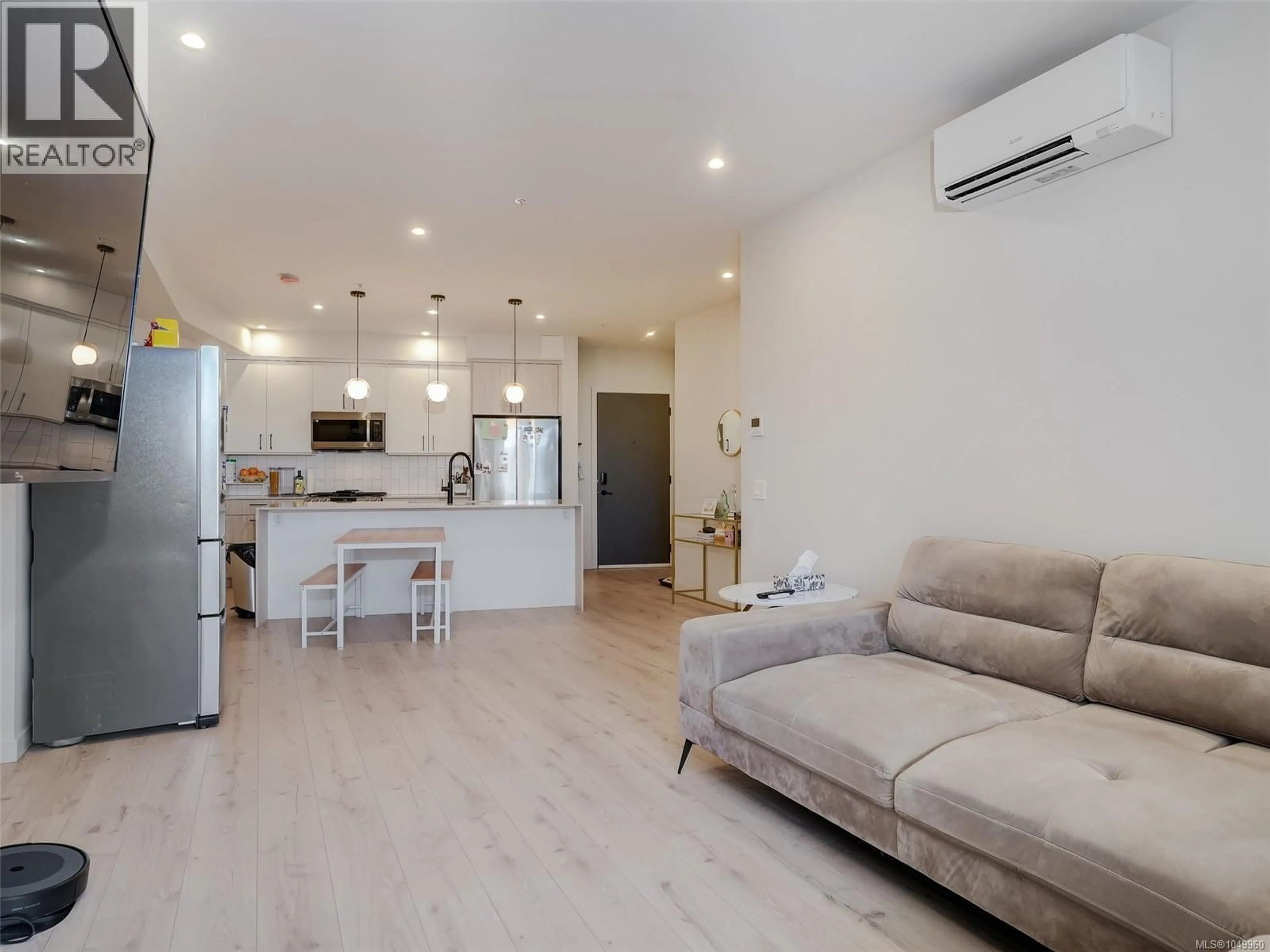 Living room with furniture, wood/laminate floor for 310 - 958 PHAROAH MEWS, Langford British Columbia V9B7A1
