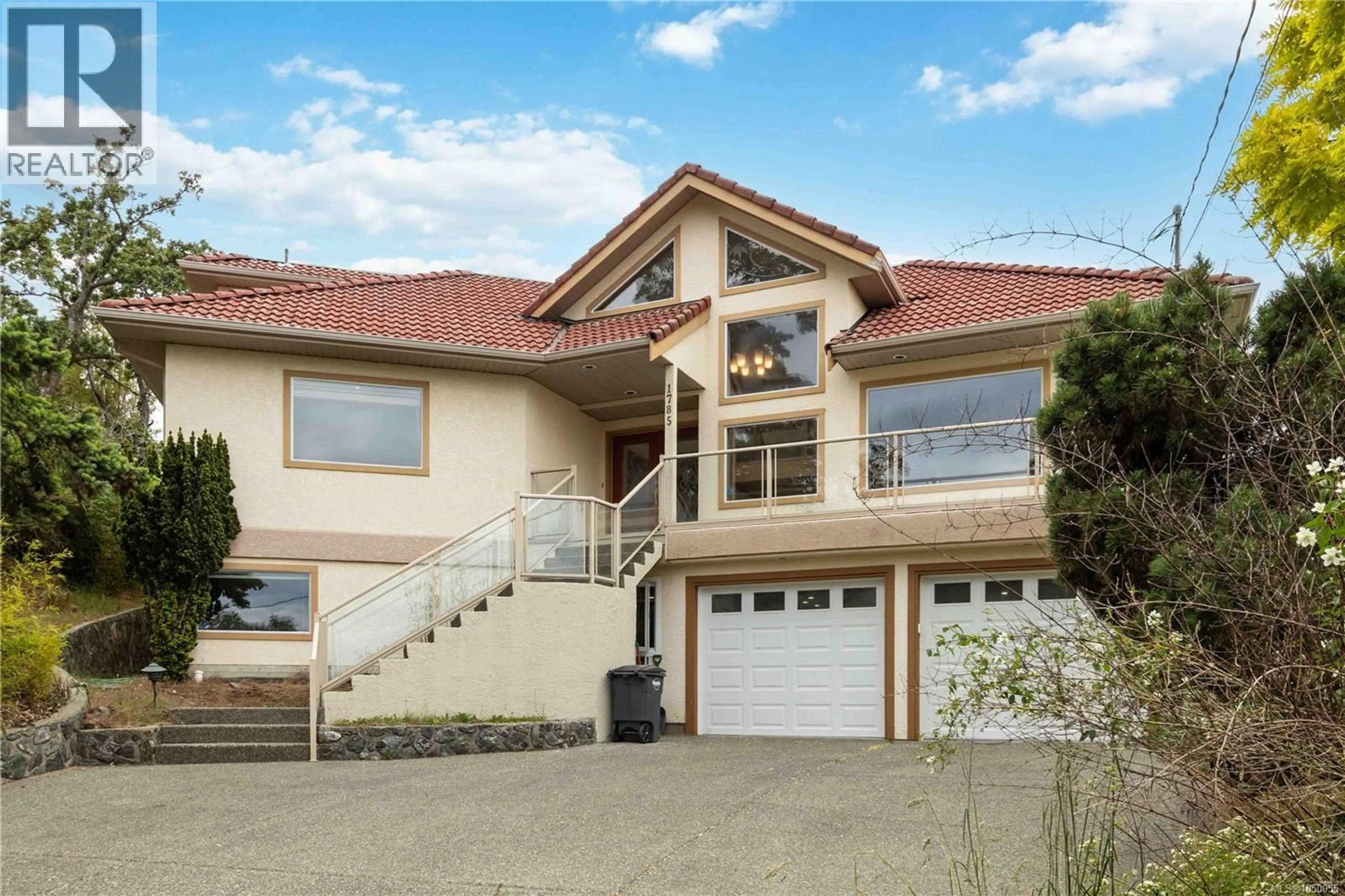 Home with vinyl exterior material, street for 1785 CEDAR HILL CROSS ROAD, Saanich British Columbia V8P2R2