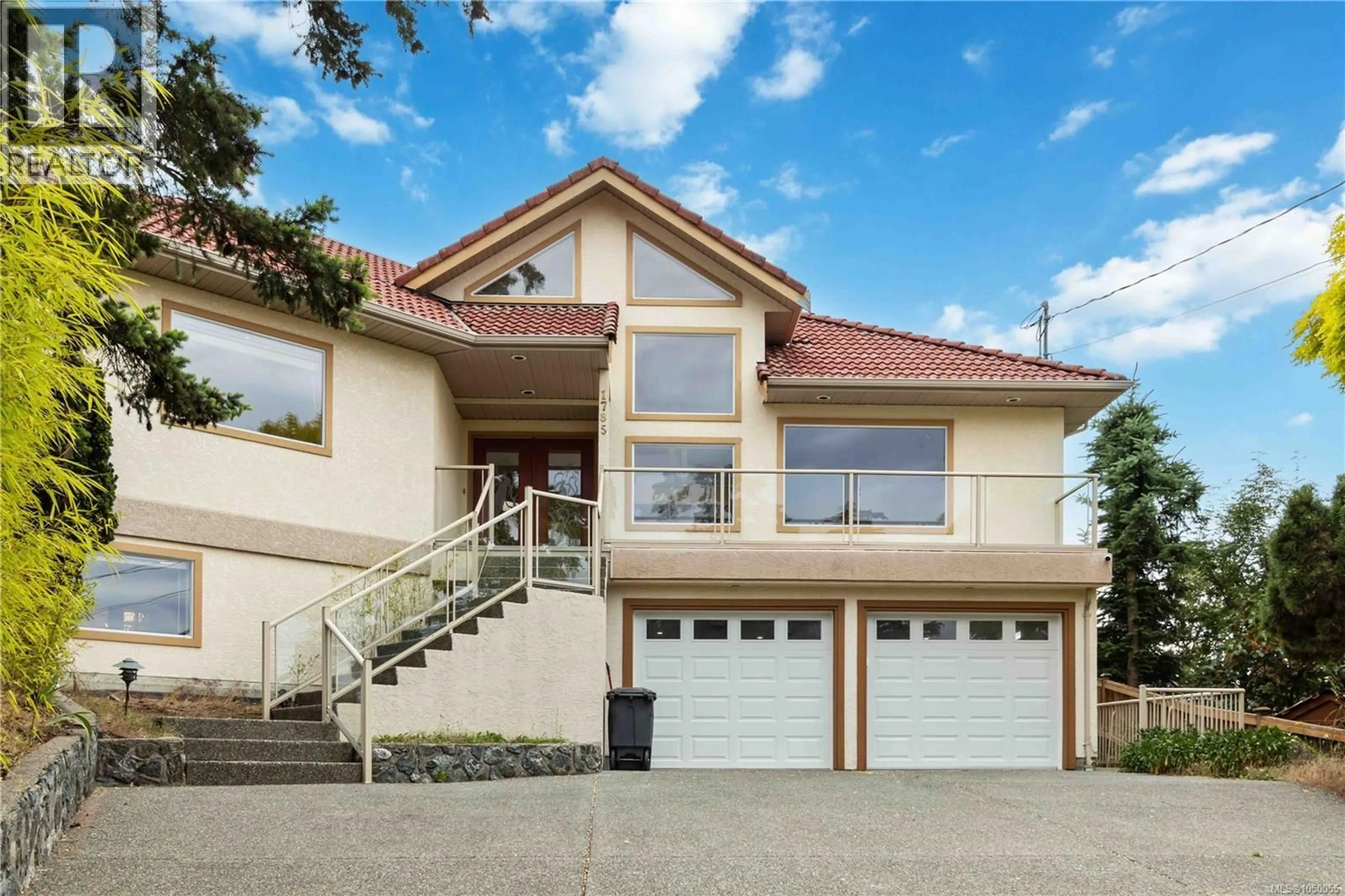 Home with vinyl exterior material, street for 1785 CEDAR HILL CROSS ROAD, Saanich British Columbia V8P2R2