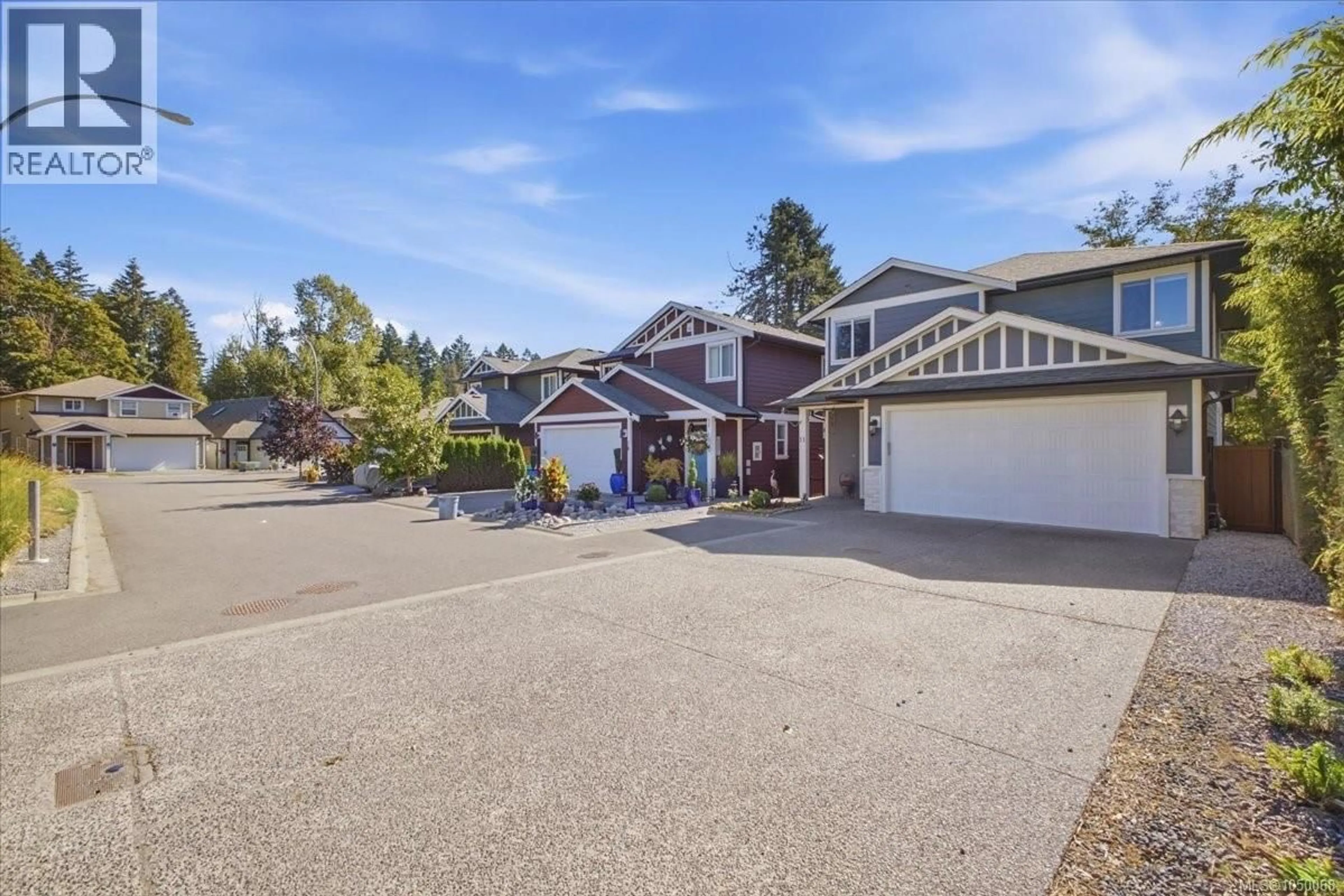 A pic from outside/outdoor area/front of a property/back of a property/a pic from drone, street for 11 - 3205 GIBBINS ROAD, Duncan British Columbia V9L1G7