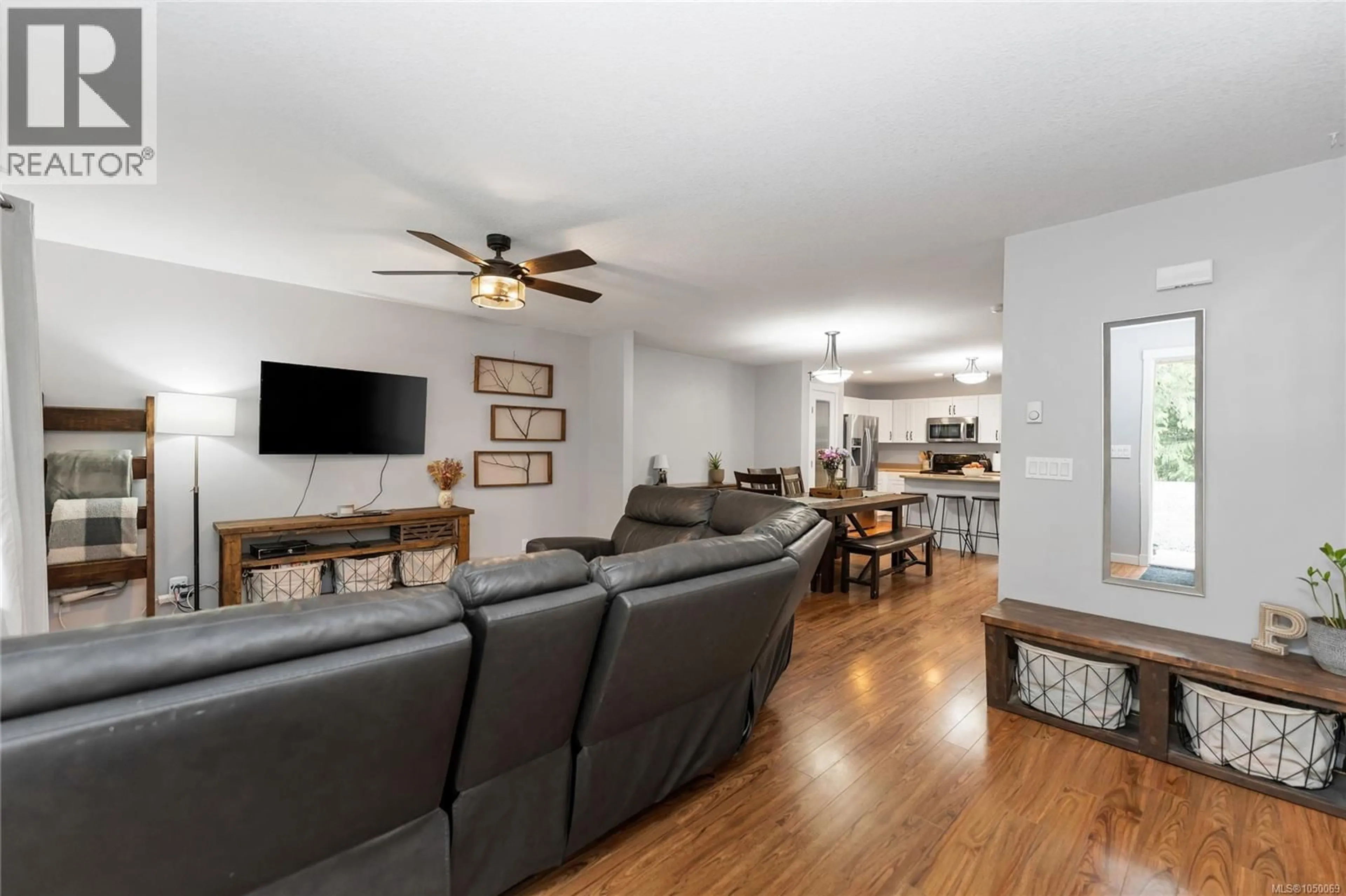 Living room with furniture, wood/laminate floor for 2071 MABLE ROAD, Shawnigan Lake British Columbia V0R2W3