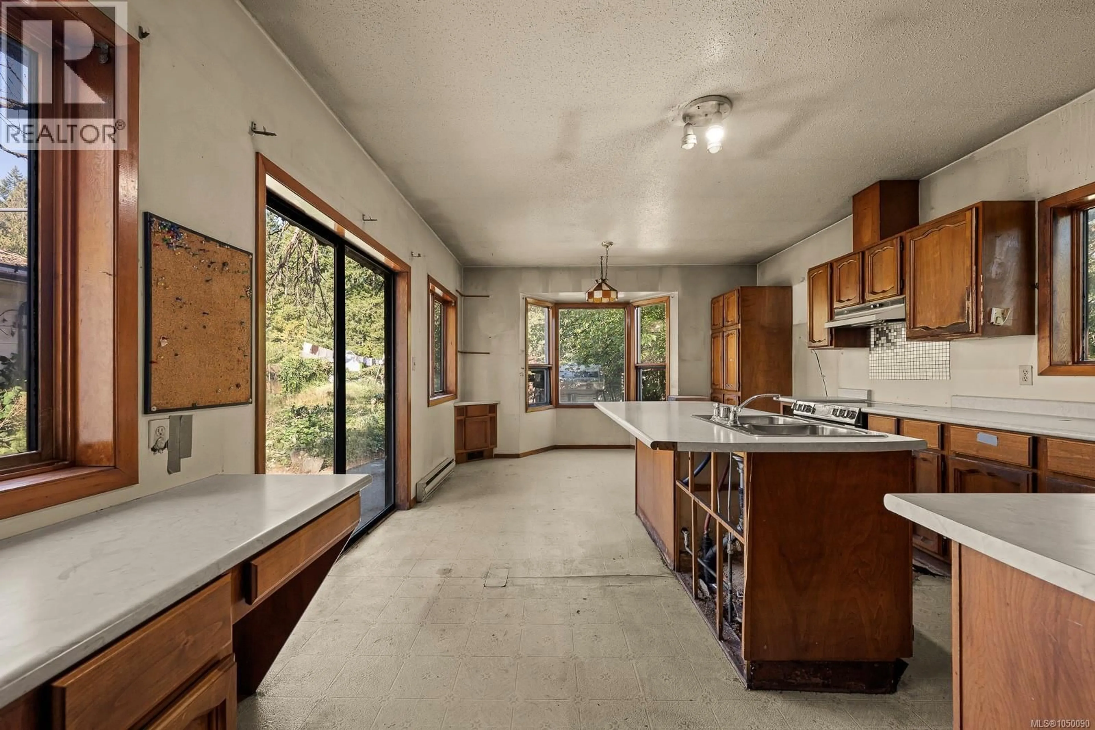 Open concept kitchen, cement floor for 2547 MABLEY ROAD, Courtenay British Columbia V9N9K2
