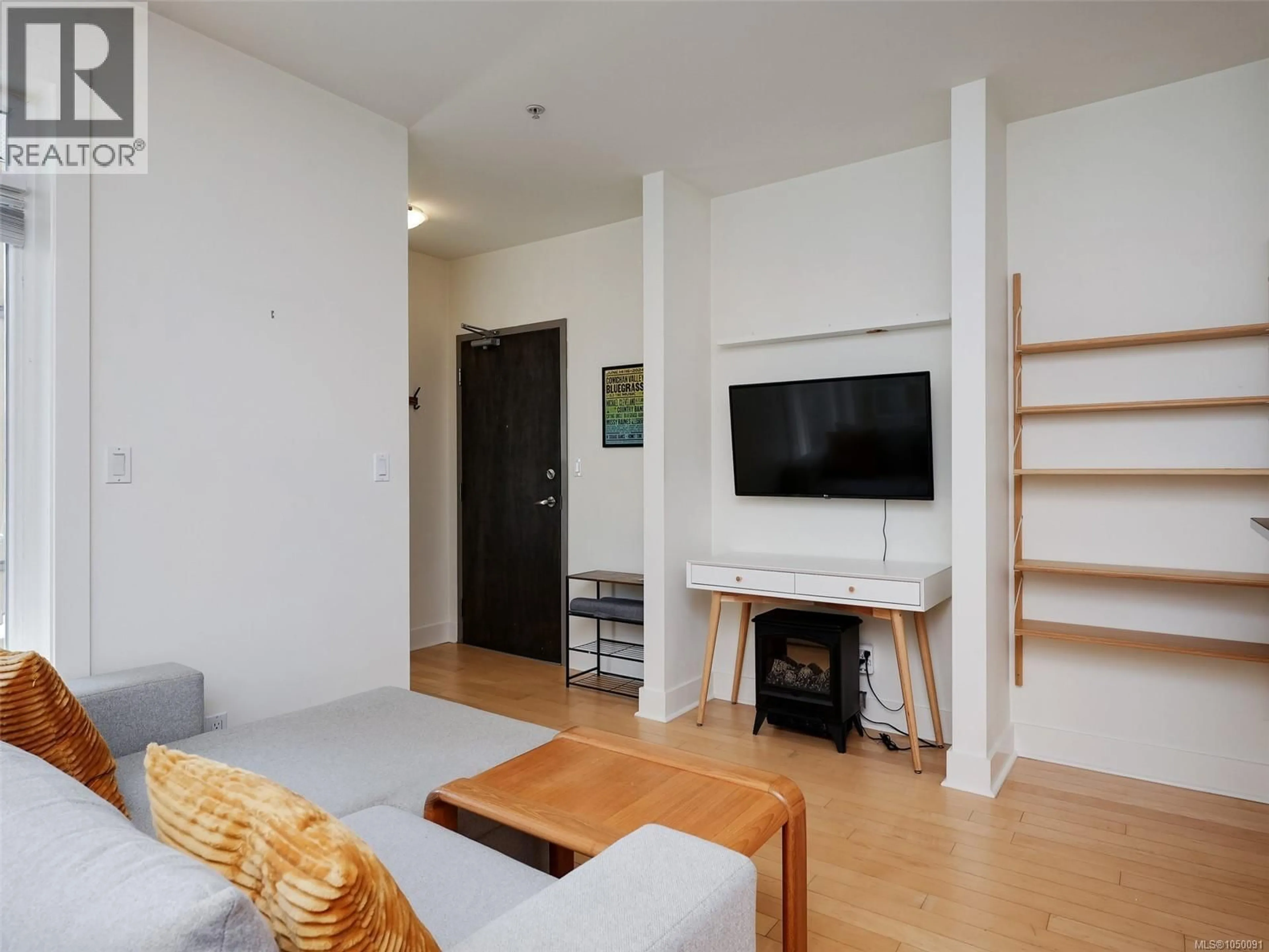 Living room with furniture, wood/laminate floor for 203 - 1022 FORT STREET, Victoria British Columbia V8V3K4