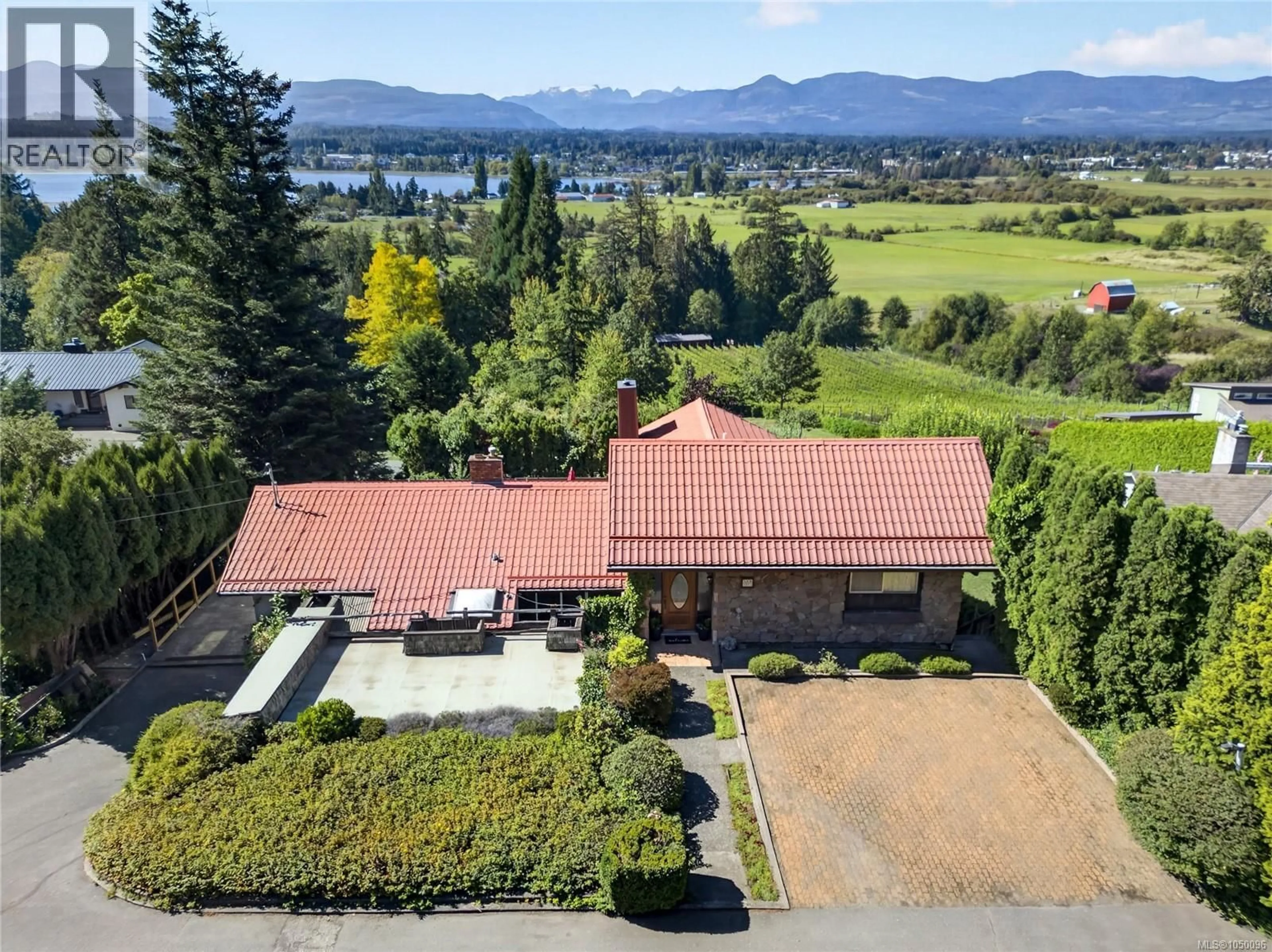 A pic from outside/outdoor area/front of a property/back of a property/a pic from drone, water/lake/river/ocean view for 2911 BACK ROAD, Courtenay British Columbia V9N9G9