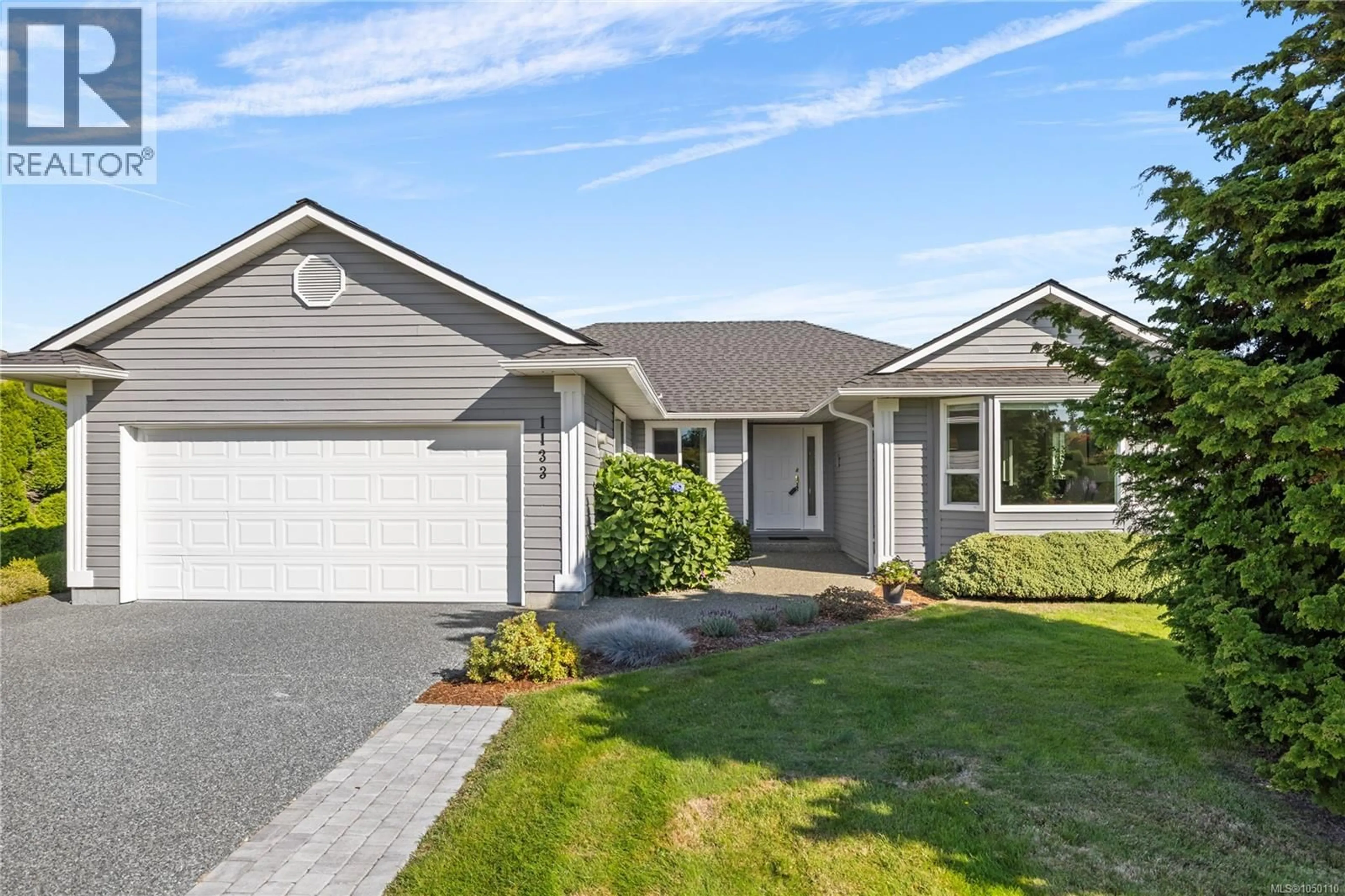 Home with vinyl exterior material, street for 1133 WELLINGTON DRIVE, Qualicum Beach British Columbia V9K2H6