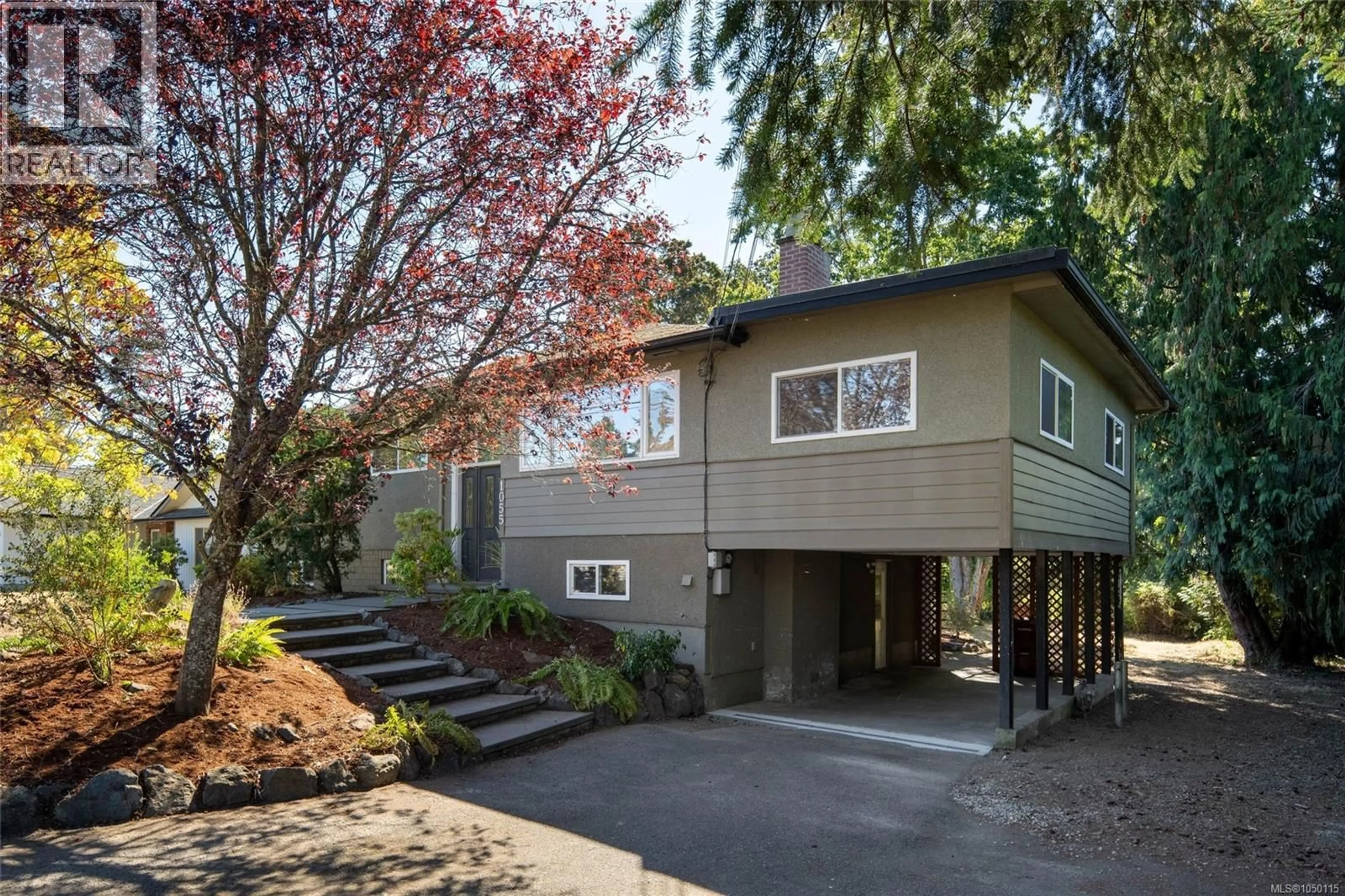 Home with vinyl exterior material, street for 1055 CLARKE ROAD, Central Saanich British Columbia V8M1C7