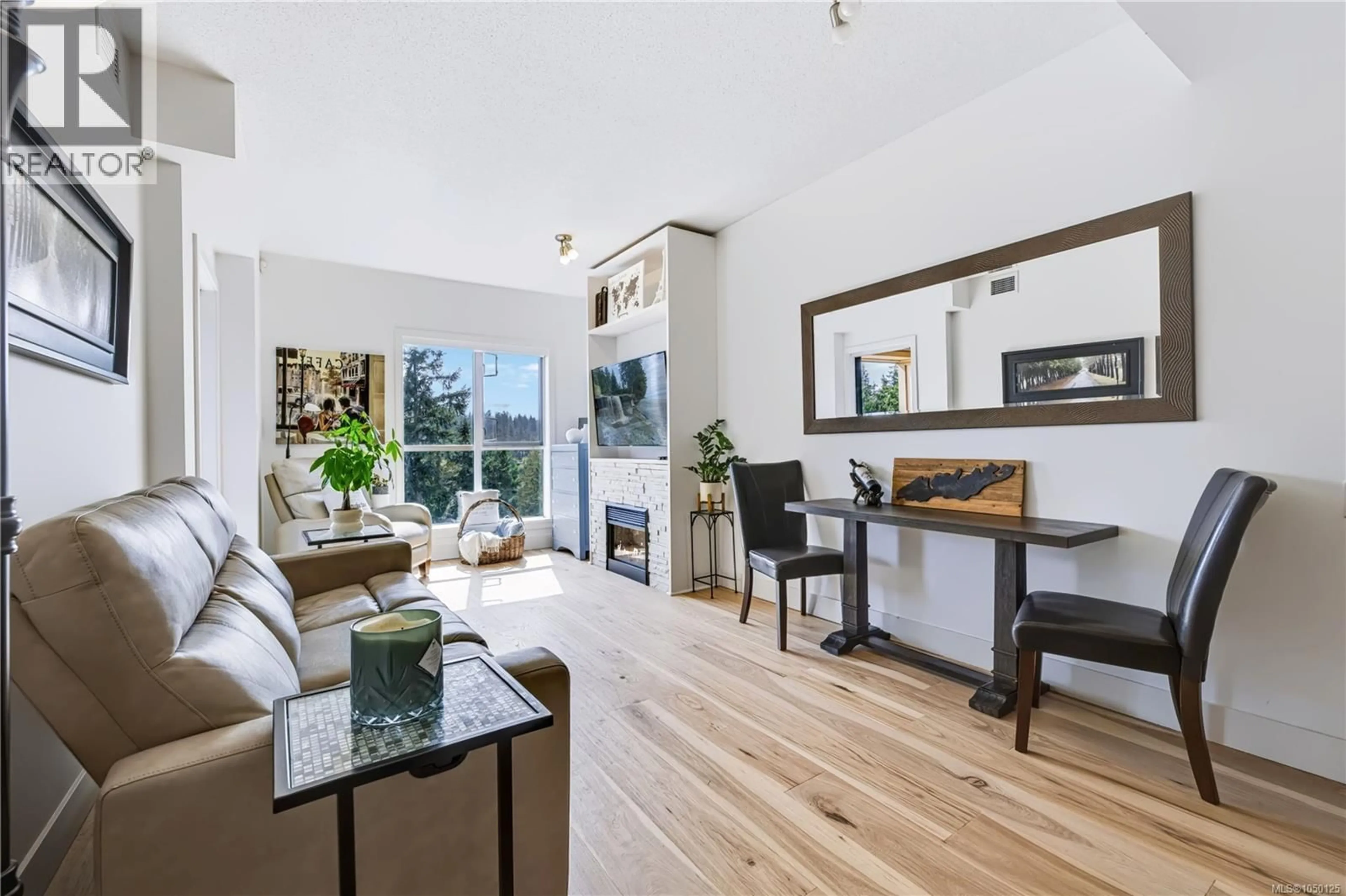 Living room with furniture, wood/laminate floor for 706 - 1400 LYNBURNE PLACE, Langford British Columbia V9B0E1