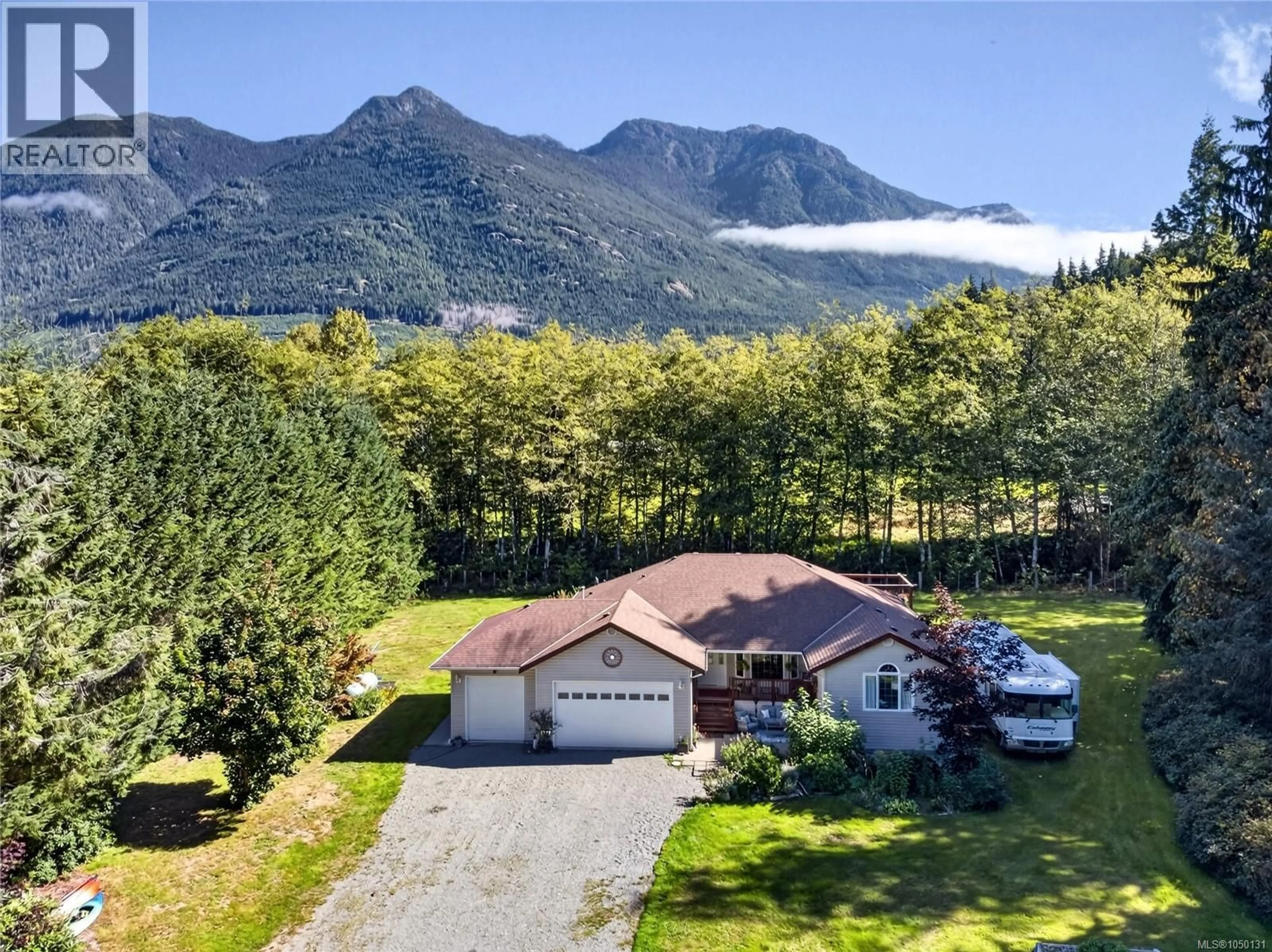 A pic from outside/outdoor area/front of a property/back of a property/a pic from drone, mountain view for 429 HOWES ROAD, Sayward British Columbia V0P1R0