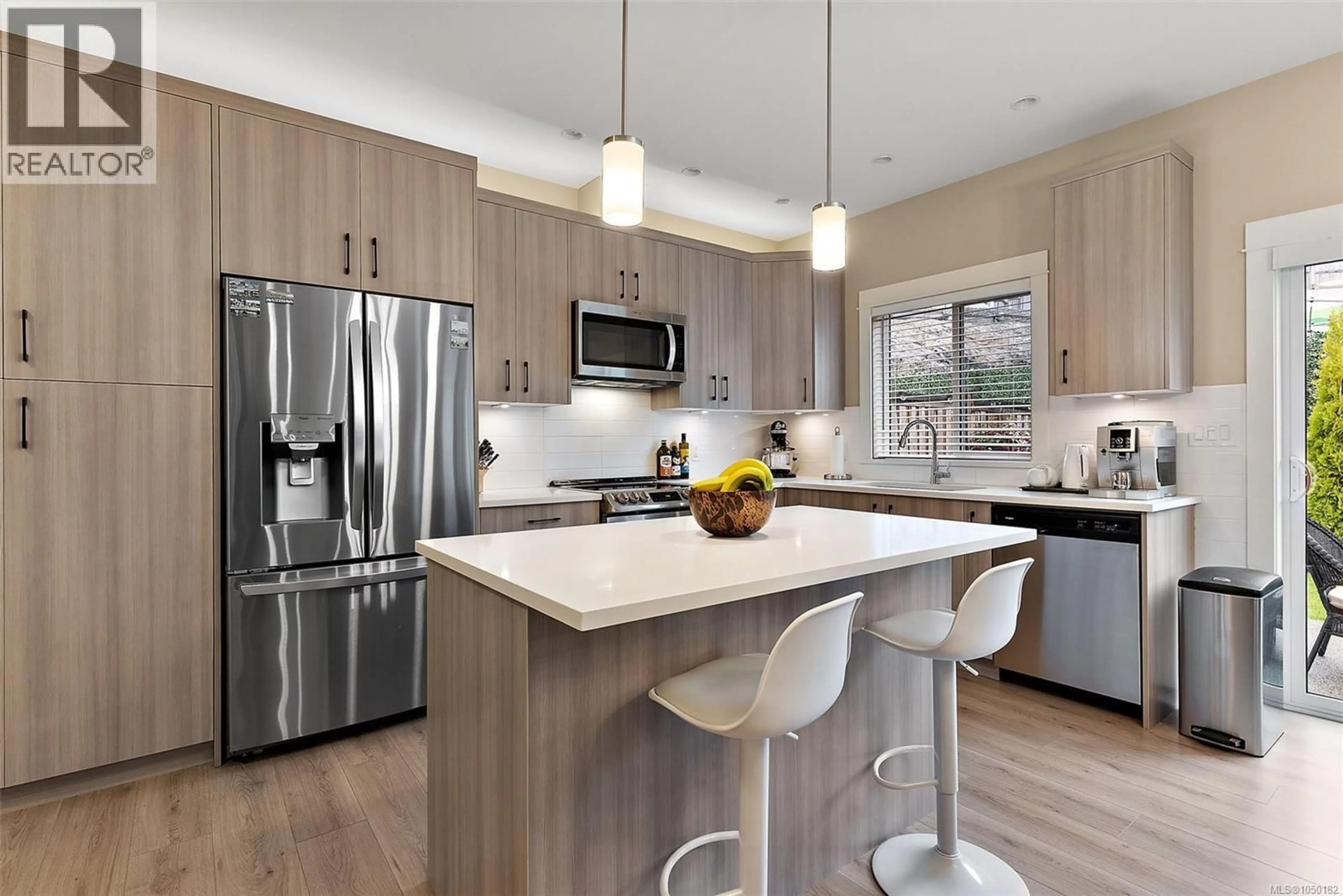 Open concept kitchen, wood/laminate floor for 8 WEST PARK PLACE, View Royal British Columbia V9B3R9