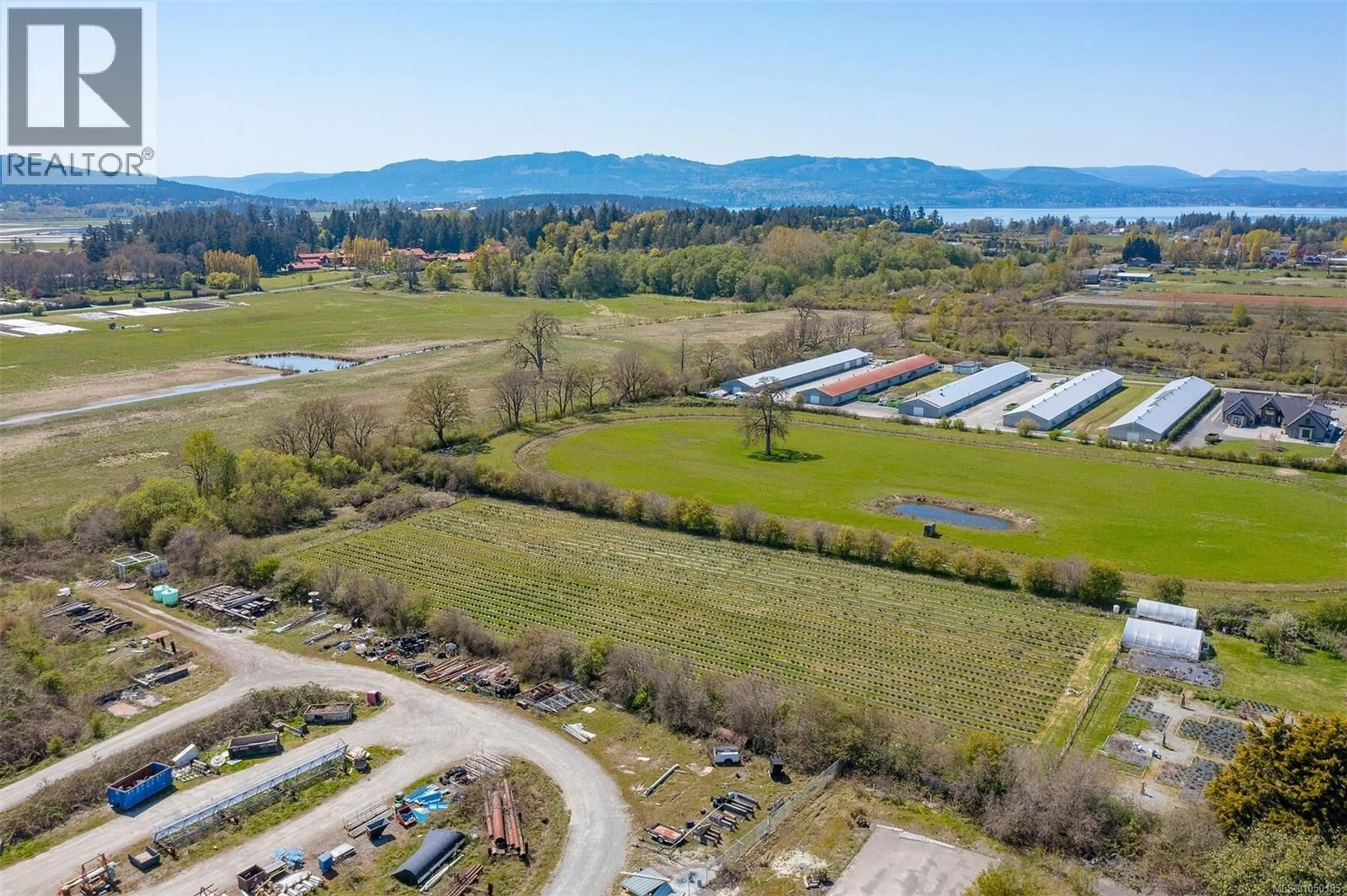 A pic from outside/outdoor area/front of a property/back of a property/a pic from drone, water/lake/river/ocean view for 1899 JOHN ROAD, North Saanich British Columbia V8L5S8