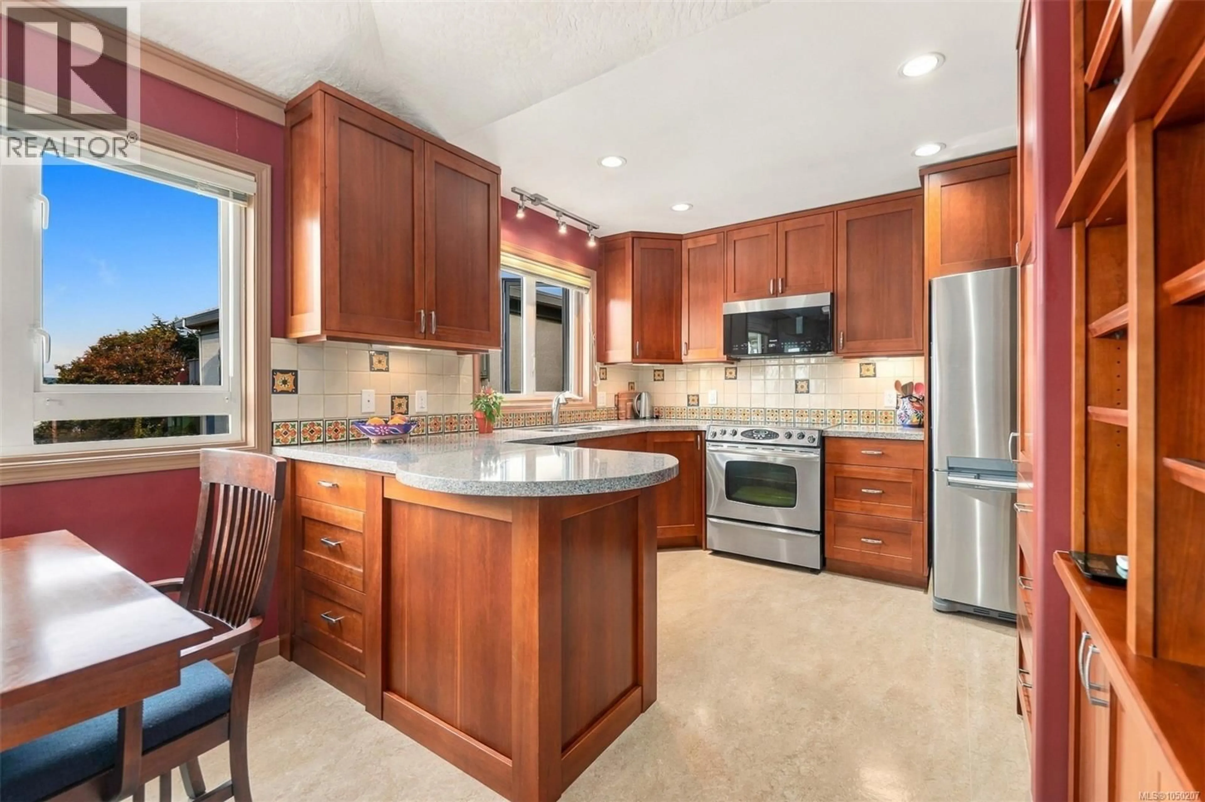 Open concept kitchen, ceramic/tile floor for 303 - 1158 FAIRFIELD ROAD, Victoria British Columbia V8V3B1