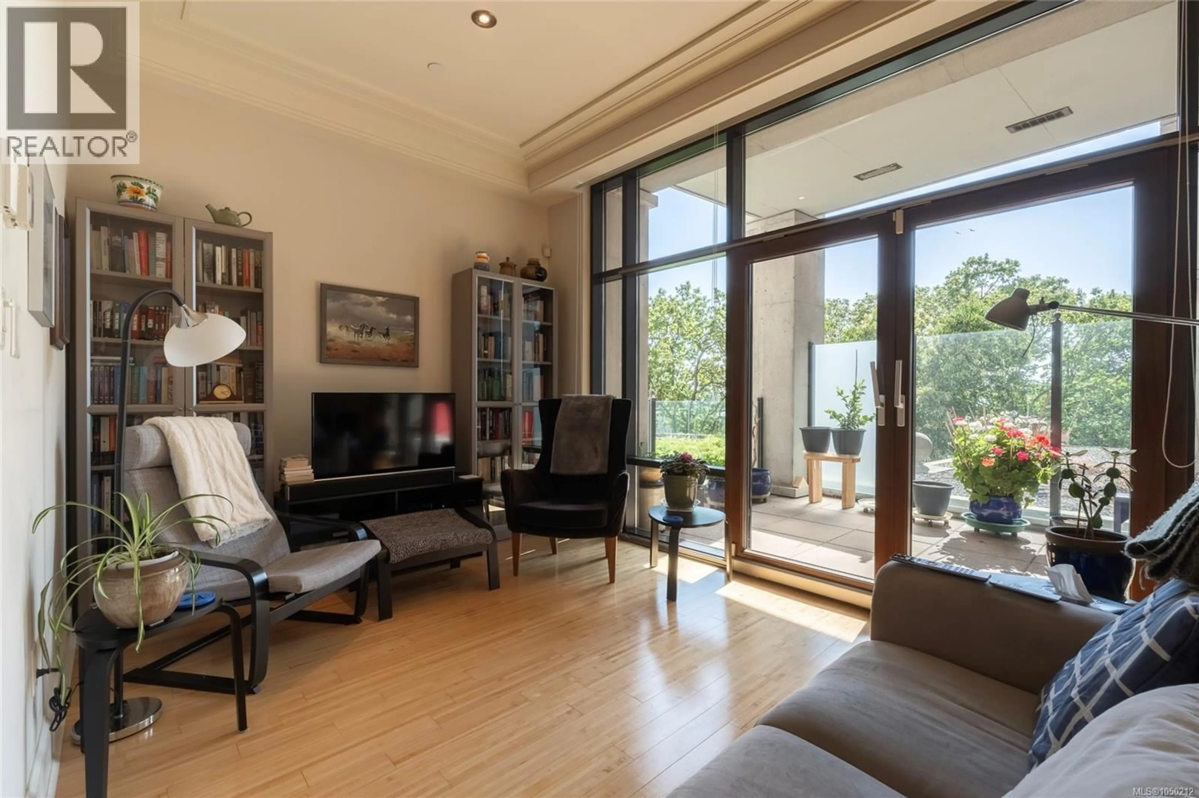 Living room with furniture, wood/laminate floor for 106 - 847 DUNSMUIR ROAD, Esquimalt British Columbia V9A0A5