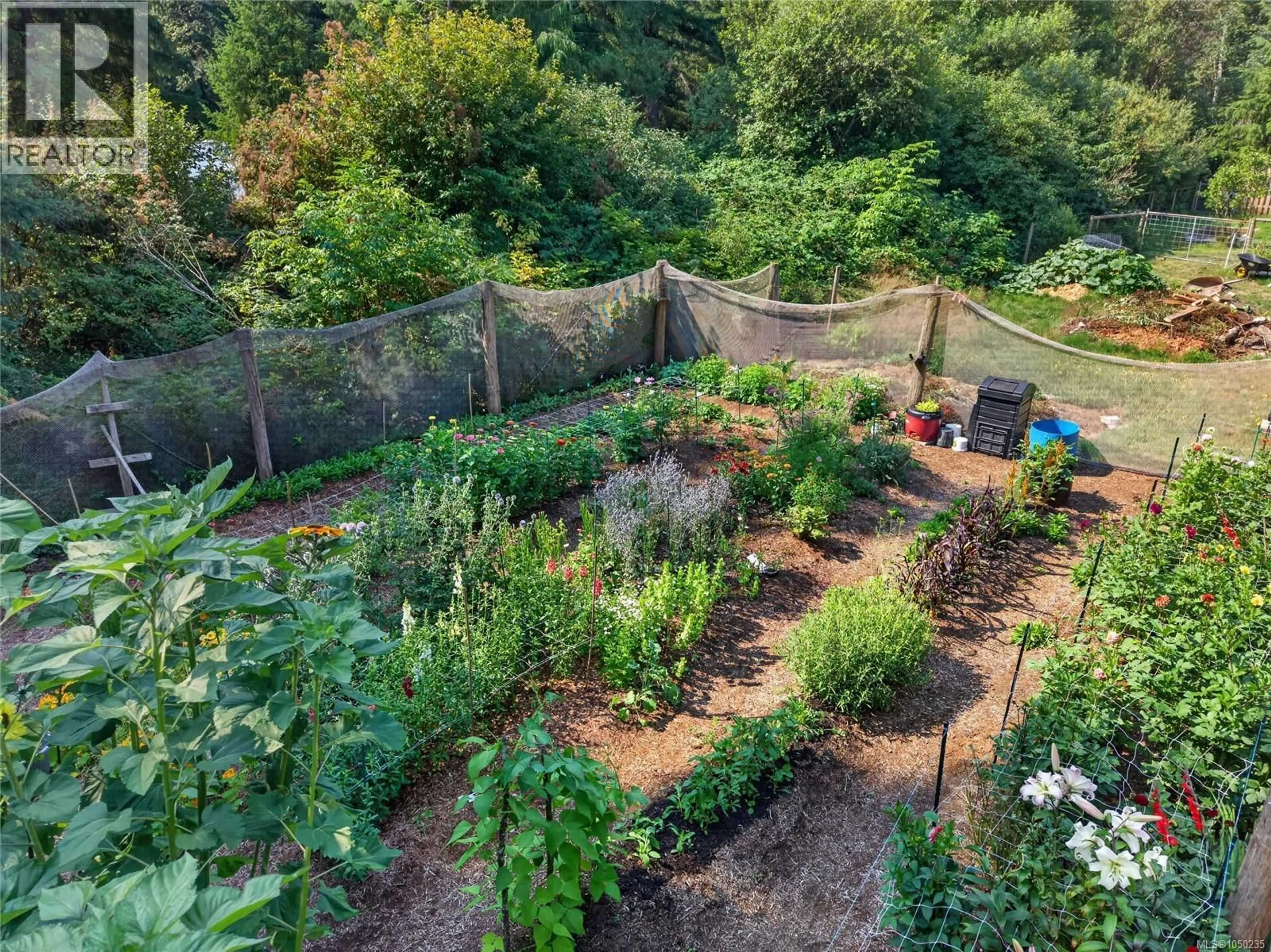 A pic from outside/outdoor area/front of a property/back of a property/a pic from drone, unknown for 2169 REGENT ROAD, Black Creek British Columbia V9J1A1