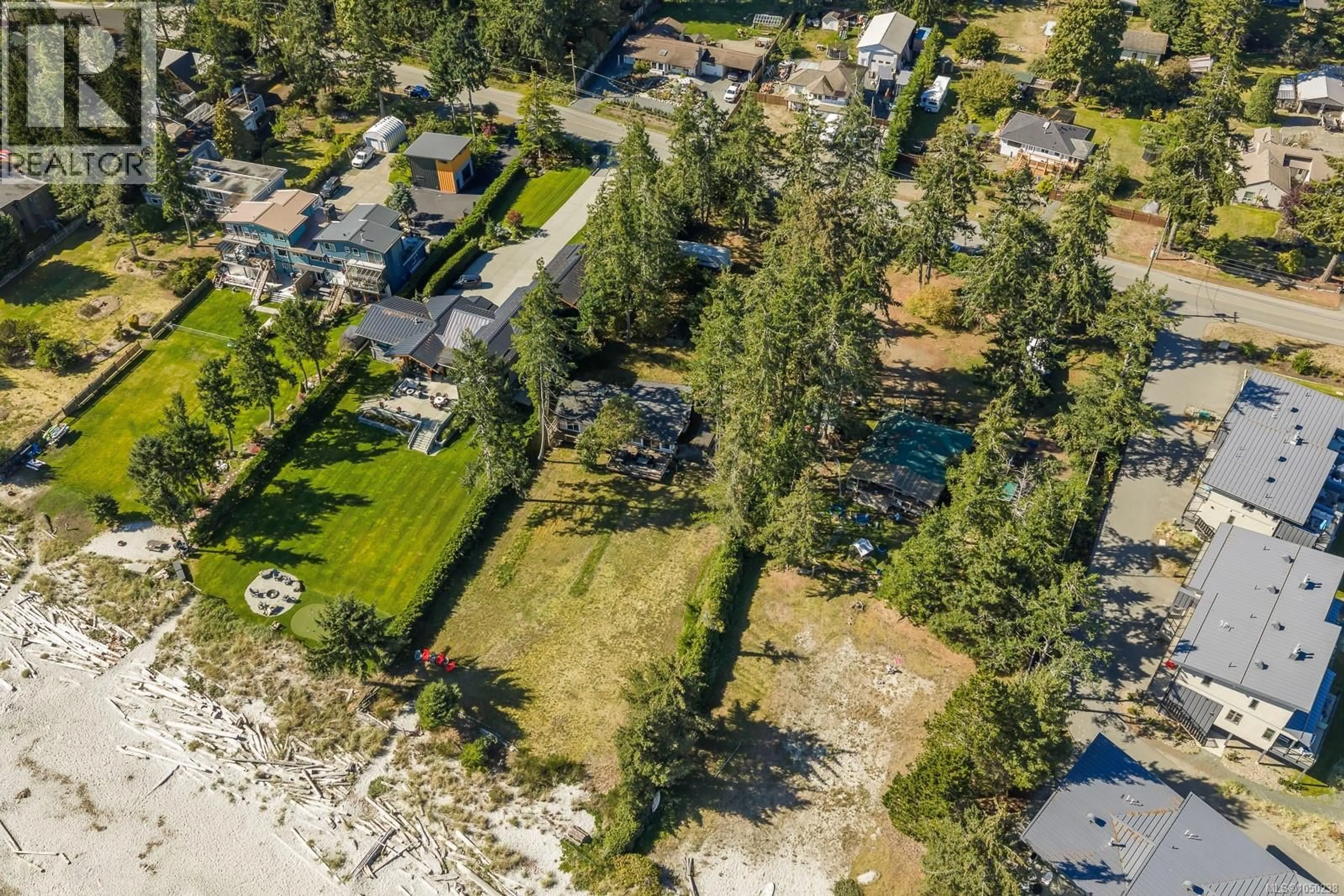 A pic from outside/outdoor area/front of a property/back of a property/a pic from drone, unknown for 8998 CLARKSON AVENUE, Black Creek British Columbia V9J1B2