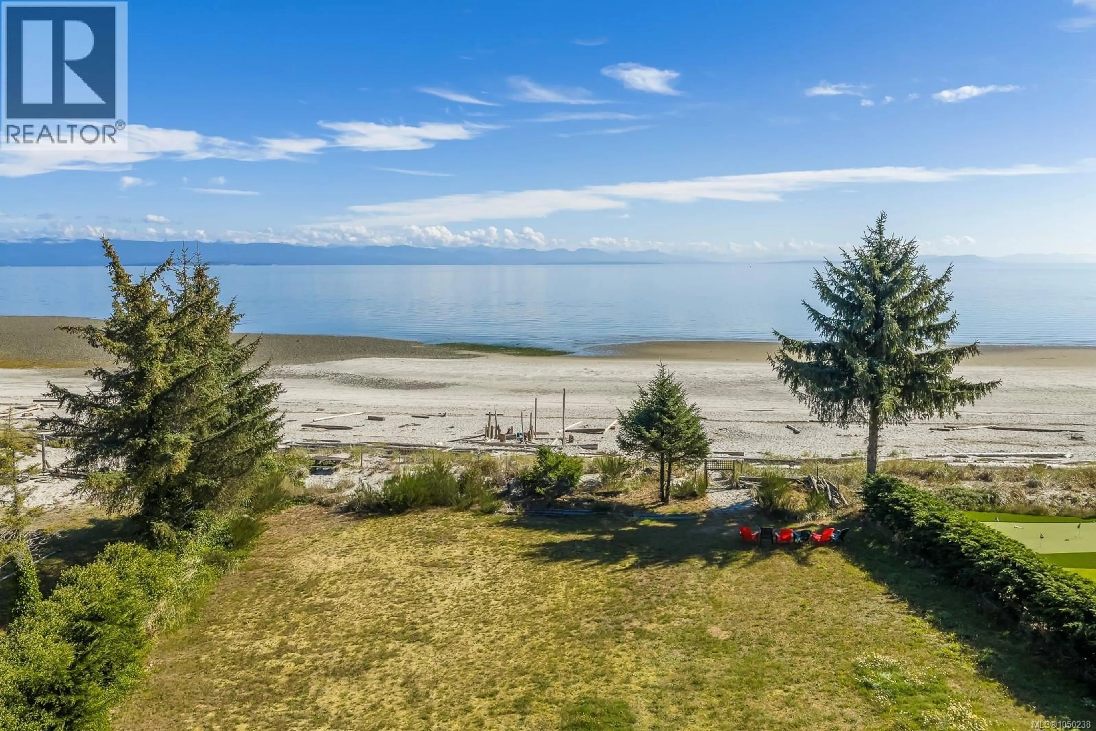 A pic from outside/outdoor area/front of a property/back of a property/a pic from drone, water/lake/river/ocean view for 8998 CLARKSON AVENUE, Black Creek British Columbia V9J1B2