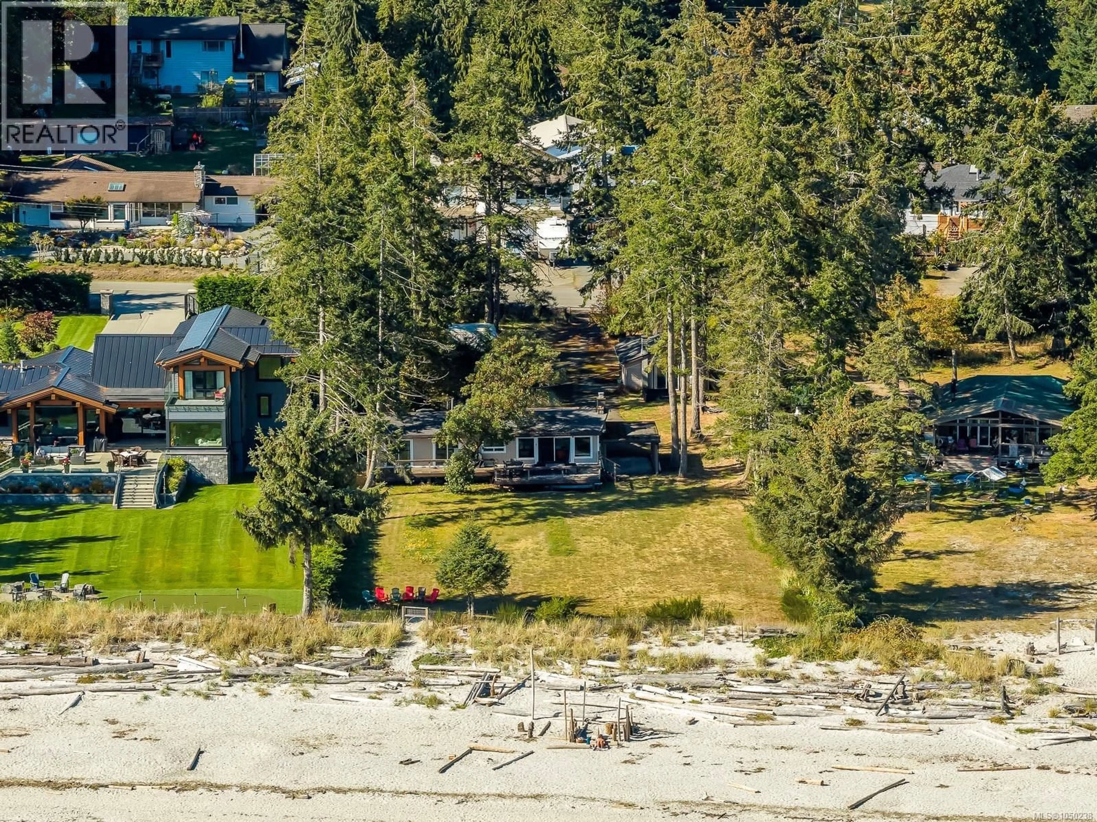 A pic from outside/outdoor area/front of a property/back of a property/a pic from drone, water/lake/river/ocean view for 8998 CLARKSON AVENUE, Black Creek British Columbia V9J1B2