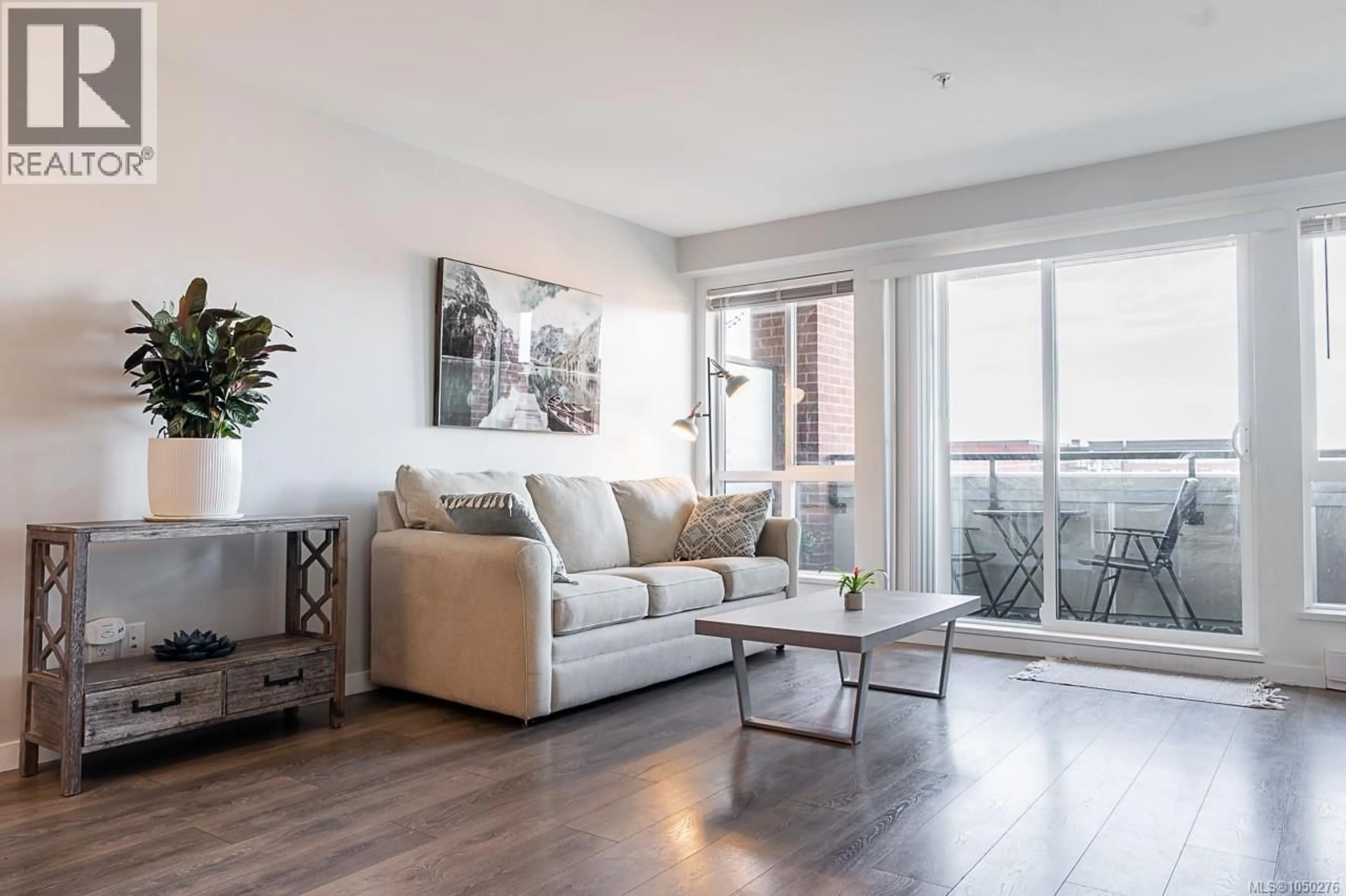 Living room with furniture, wood/laminate floor for 302 - 517 FISGARD STREET, Victoria British Columbia V8W0C5