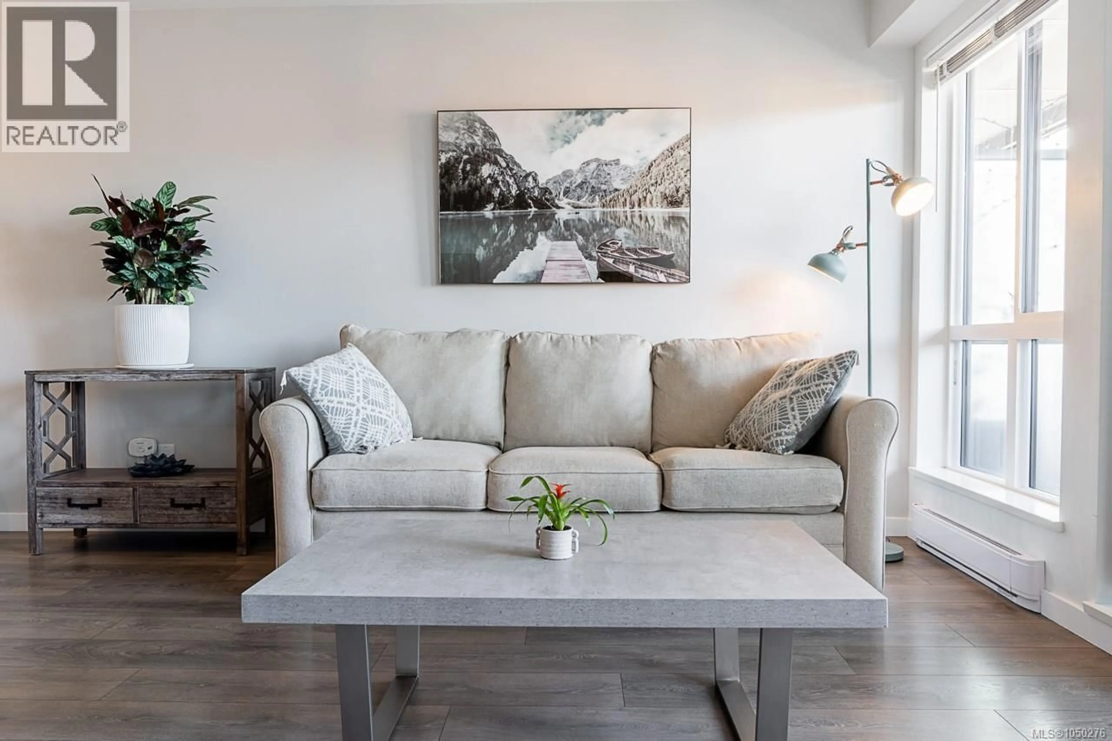 Living room with furniture, wood/laminate floor for 302 - 517 FISGARD STREET, Victoria British Columbia V8W0C5