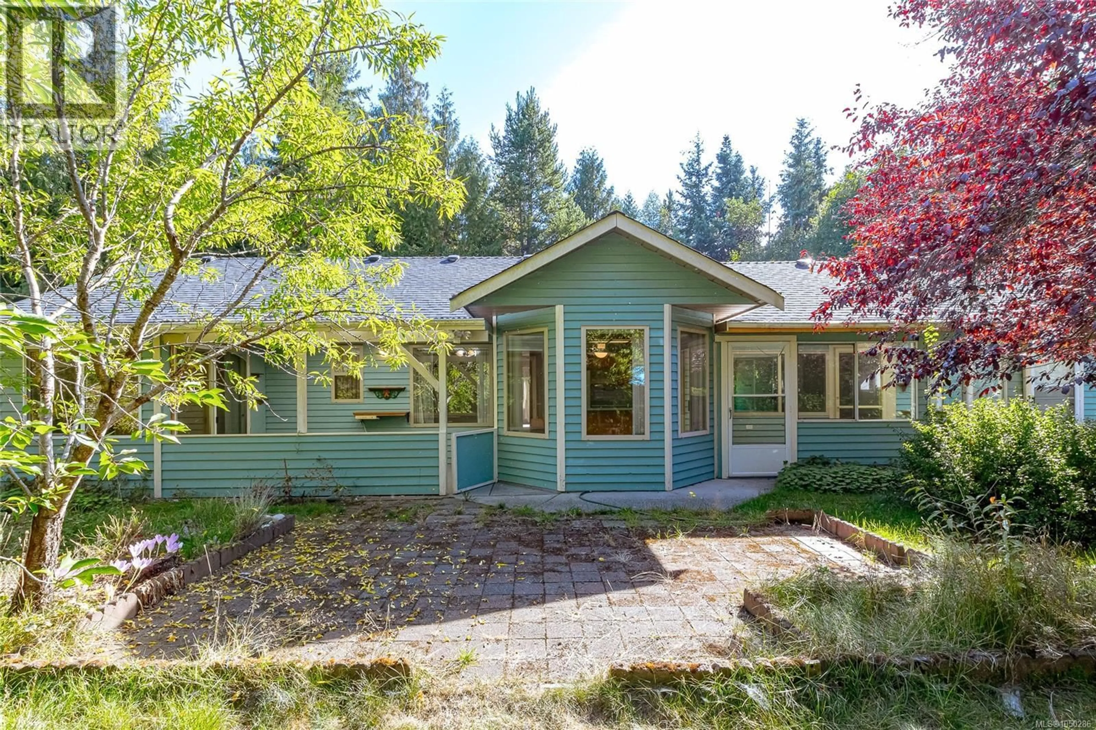 Home with vinyl exterior material, street for 1205 CORCAN ROAD, Qualicum Beach British Columbia V9K2R6