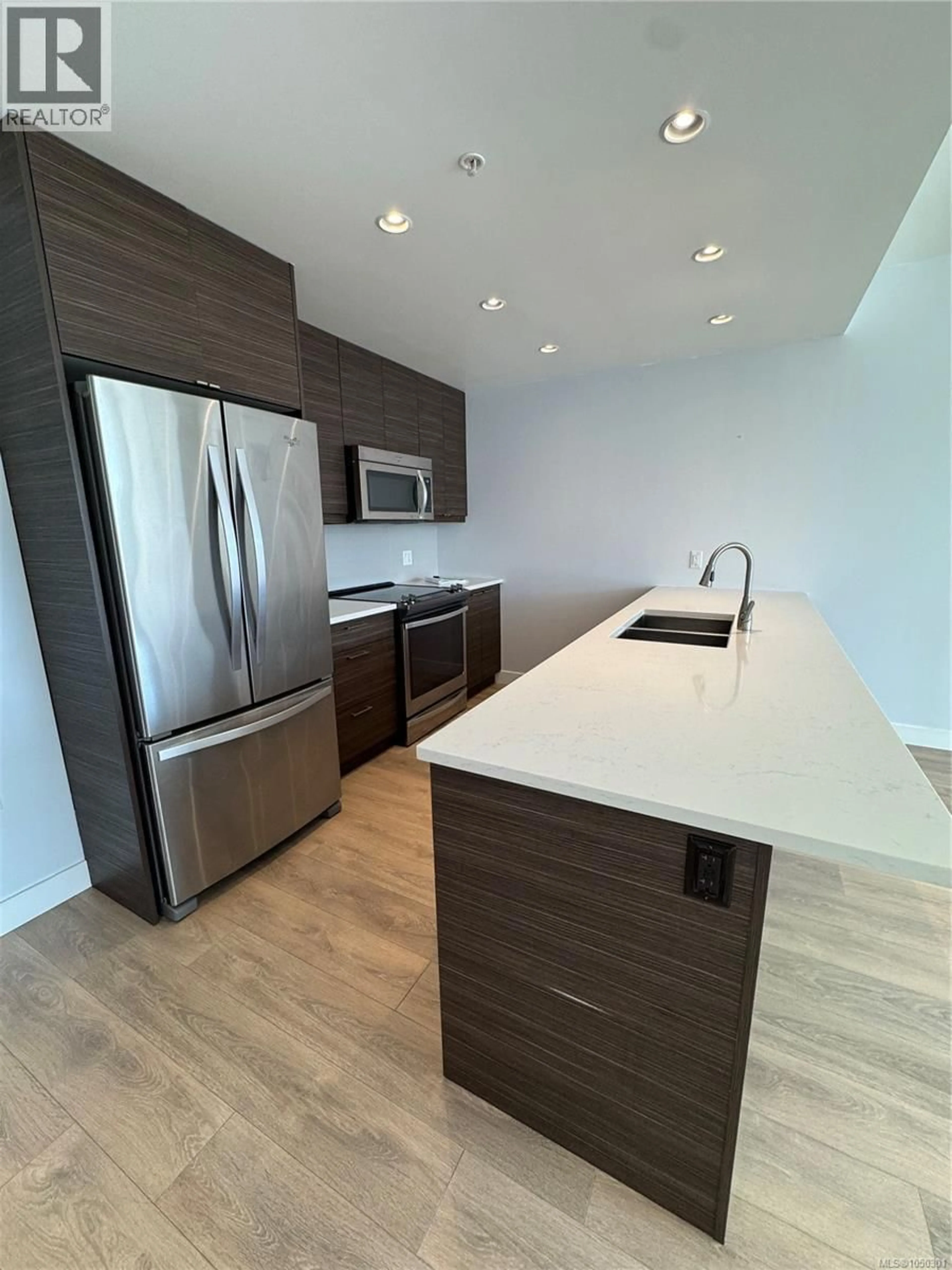 Open concept kitchen, wood/laminate floor for 303 - 300 BELMONT ROAD, Colwood British Columbia V9C1B1