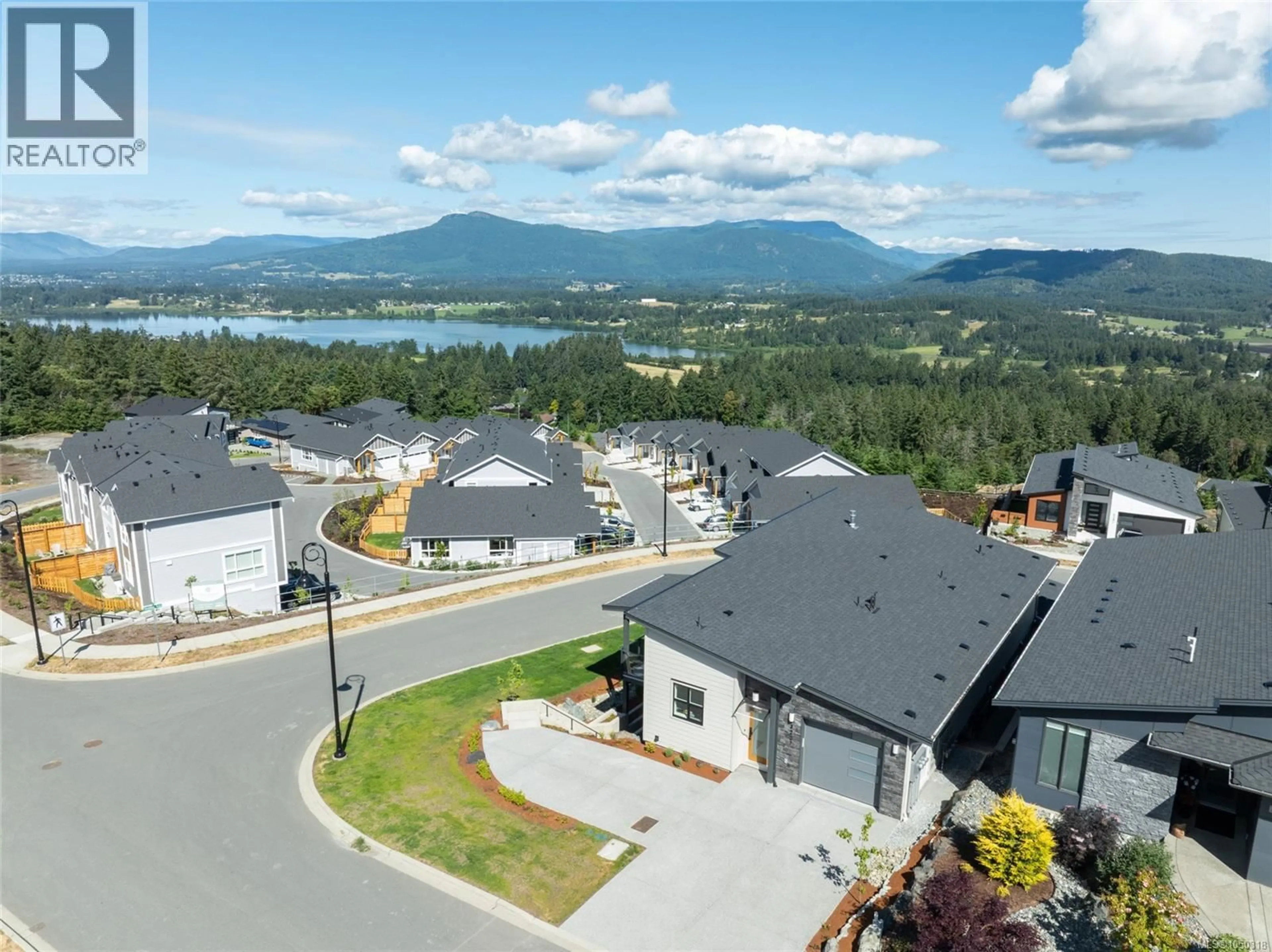 A pic from outside/outdoor area/front of a property/back of a property/a pic from drone, mountain view for 3227 WOODRUSH DRIVE, Duncan British Columbia V9L0J9