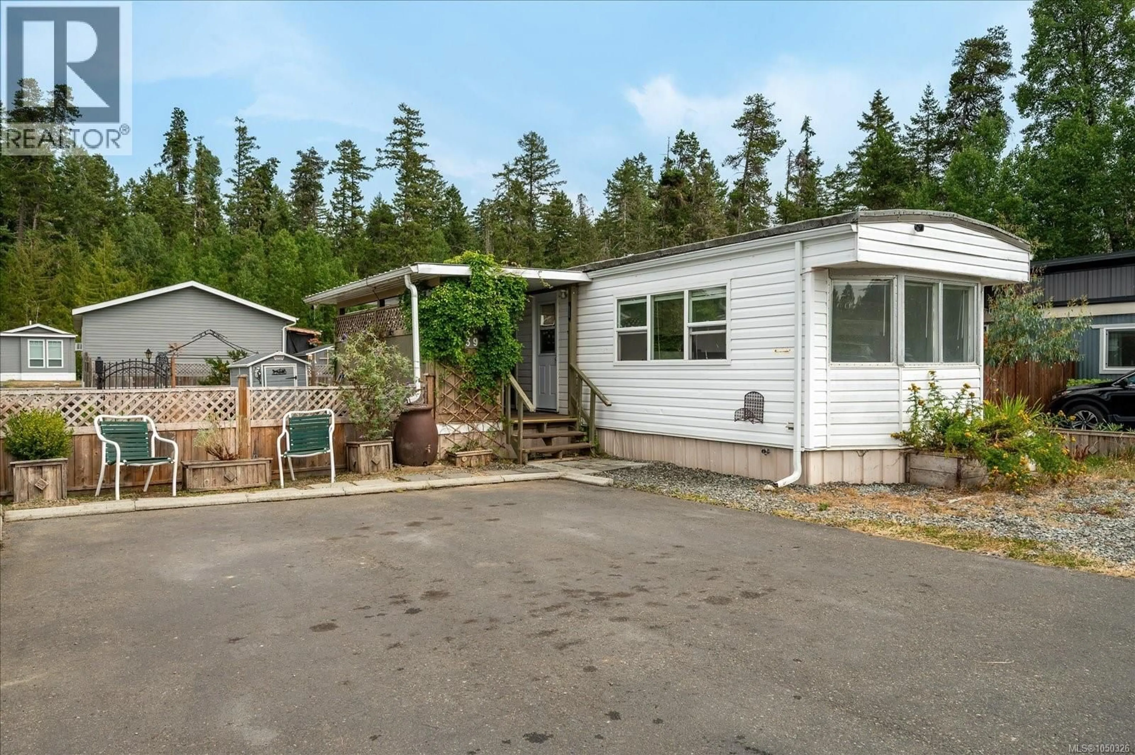 A pic from outside/outdoor area/front of a property/back of a property/a pic from drone, street for 39 - 1050 BOWLBY ROAD, Coombs British Columbia V0R1M0