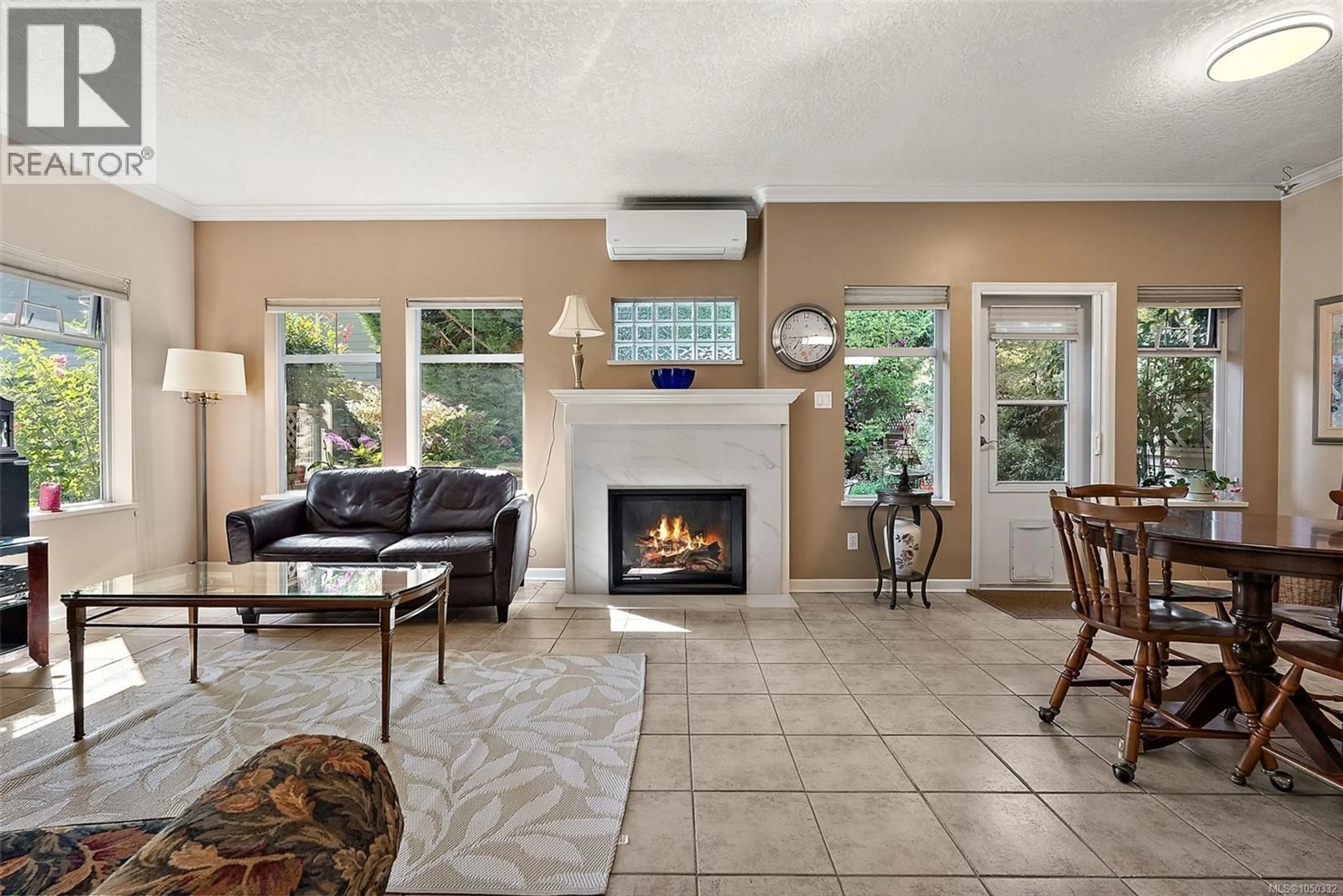 Living room with furniture, ceramic/tile floor for 106 - 1110 WILLOW STREET, Saanich British Columbia V8X3K2