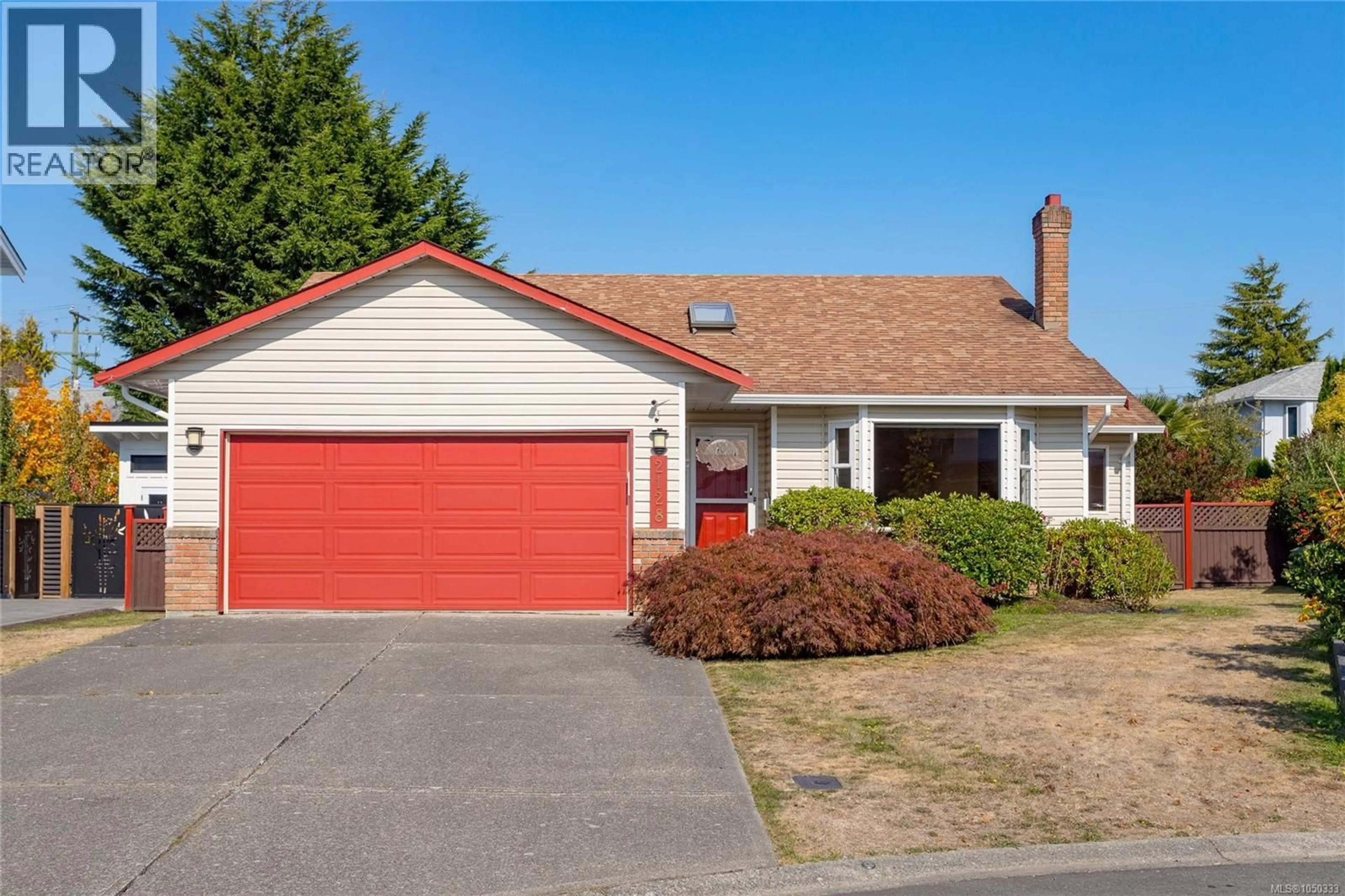 Home with vinyl exterior material, street for 2128 COLINWOOD ROAD, Sidney British Columbia V8L4H5