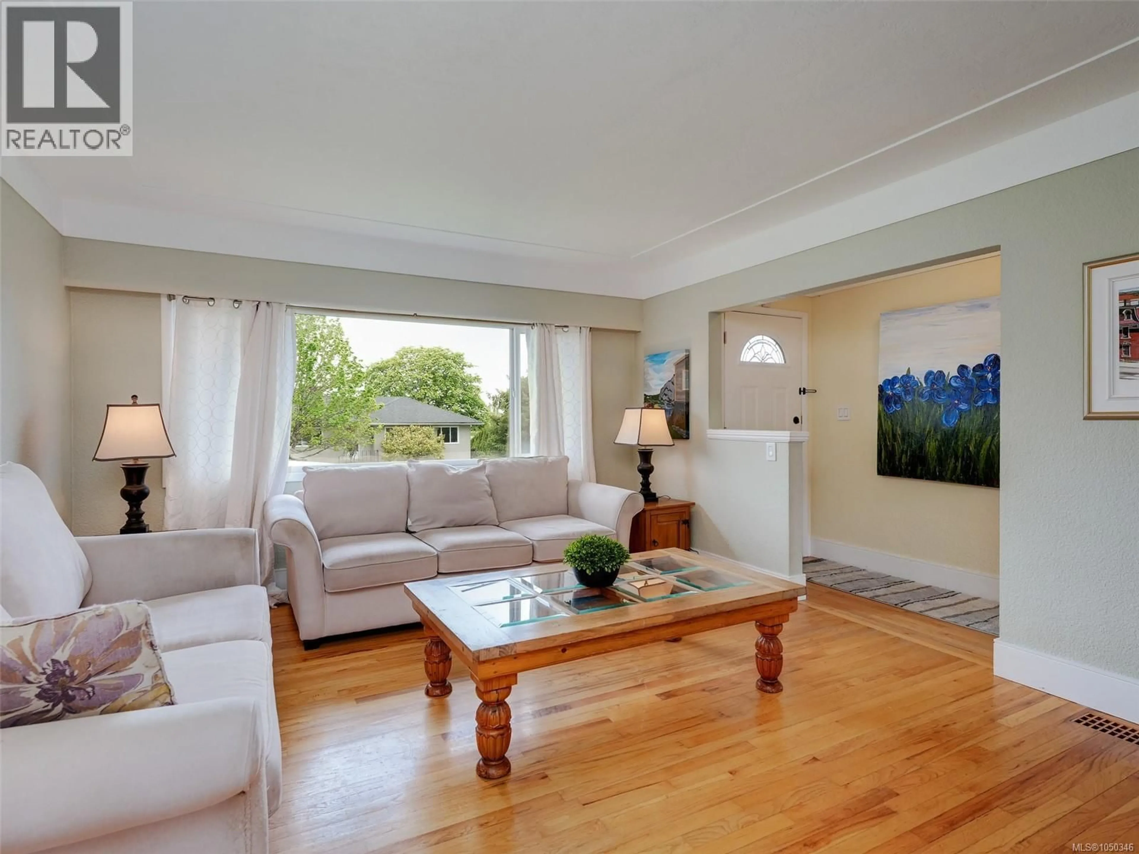 Living room with furniture, wood/laminate floor for 530 DUMERESQ STREET, Saanich British Columbia V8Z1X2
