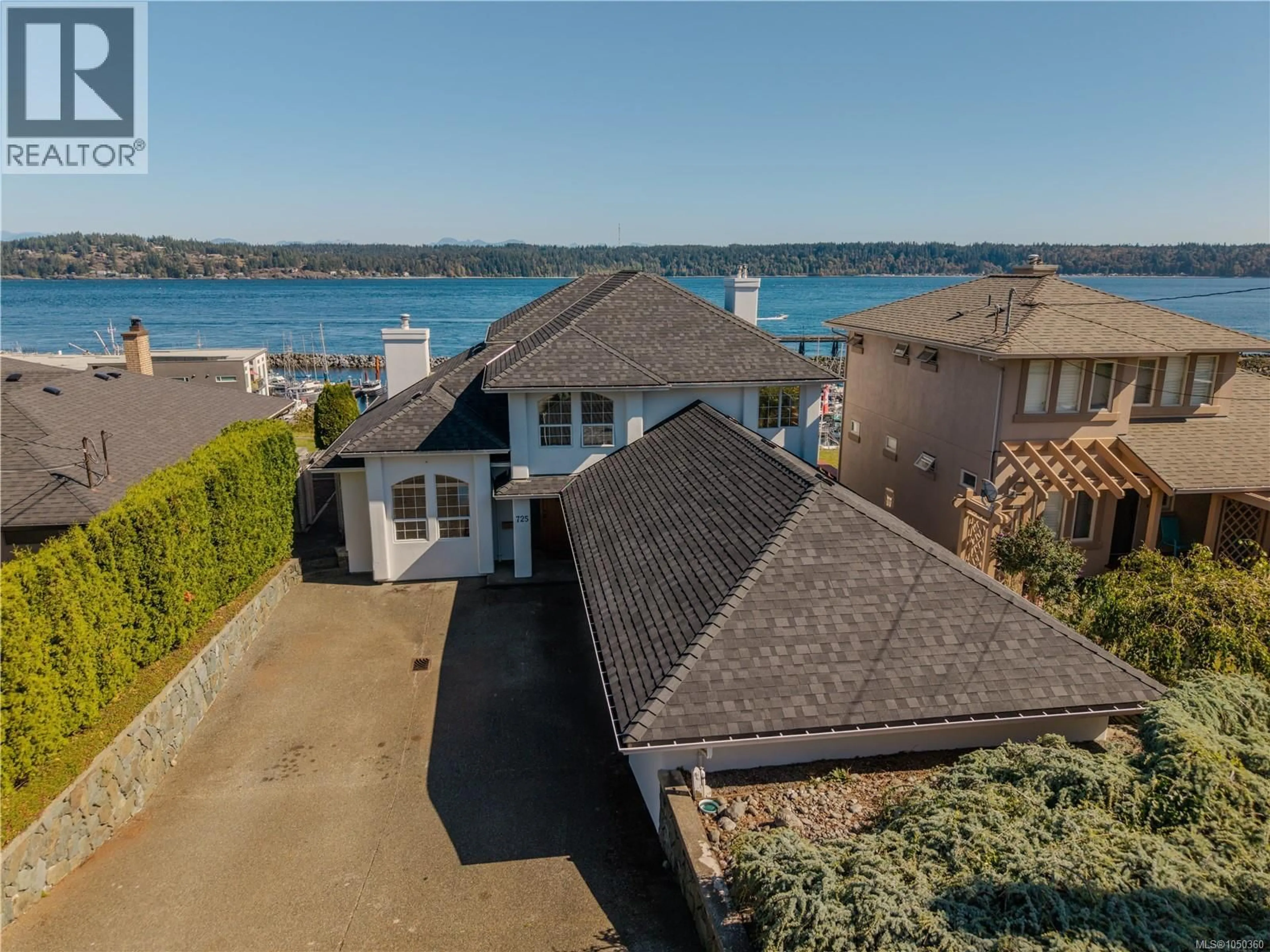 A pic from outside/outdoor area/front of a property/back of a property/a pic from drone, water/lake/river/ocean view for 725 THULIN STREET, Campbell River British Columbia V9W2L4