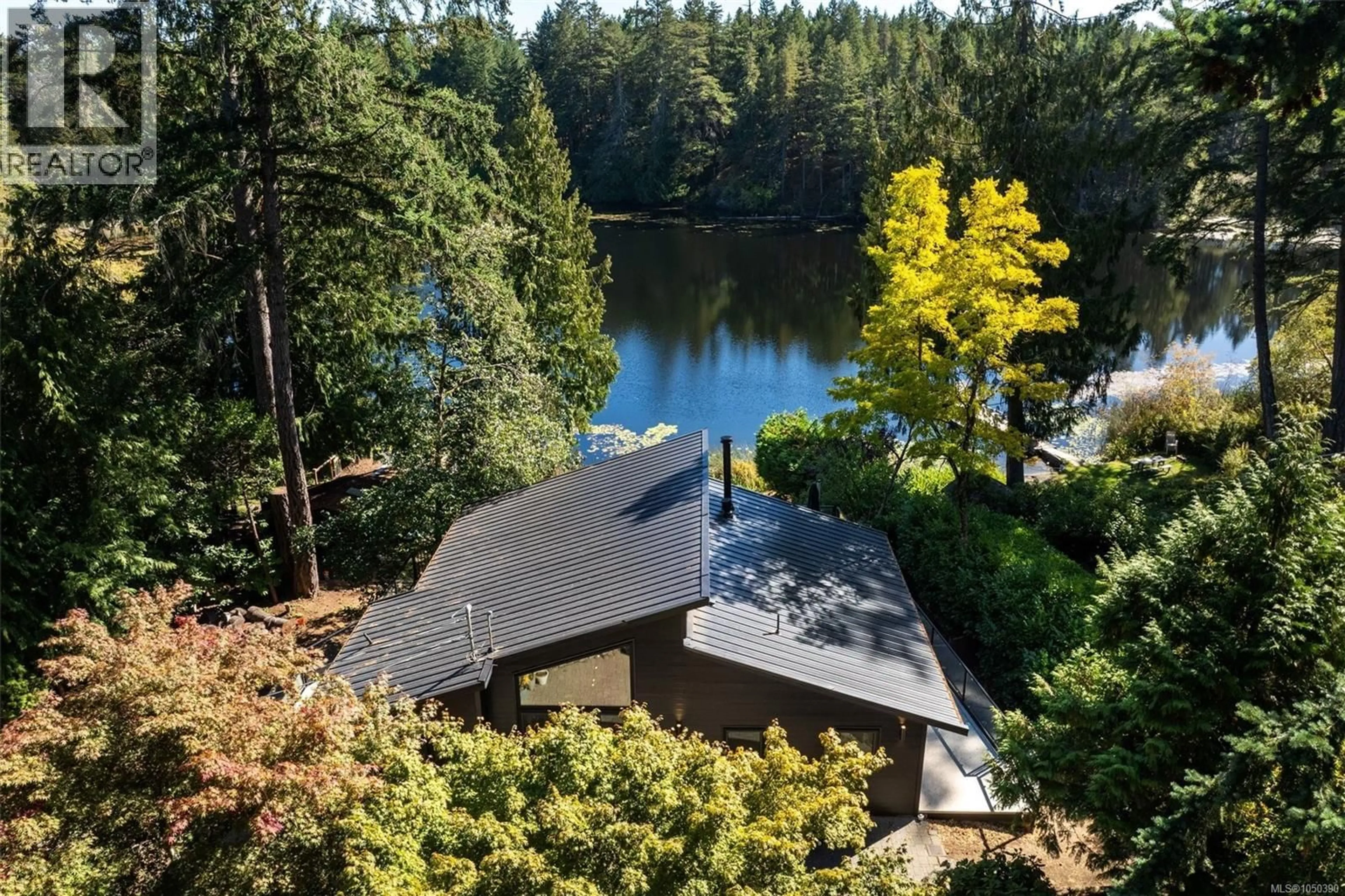 A pic from outside/outdoor area/front of a property/back of a property/a pic from drone, water/lake/river/ocean view for 685 LOST LAKE ROAD, Highlands British Columbia V9B6E3