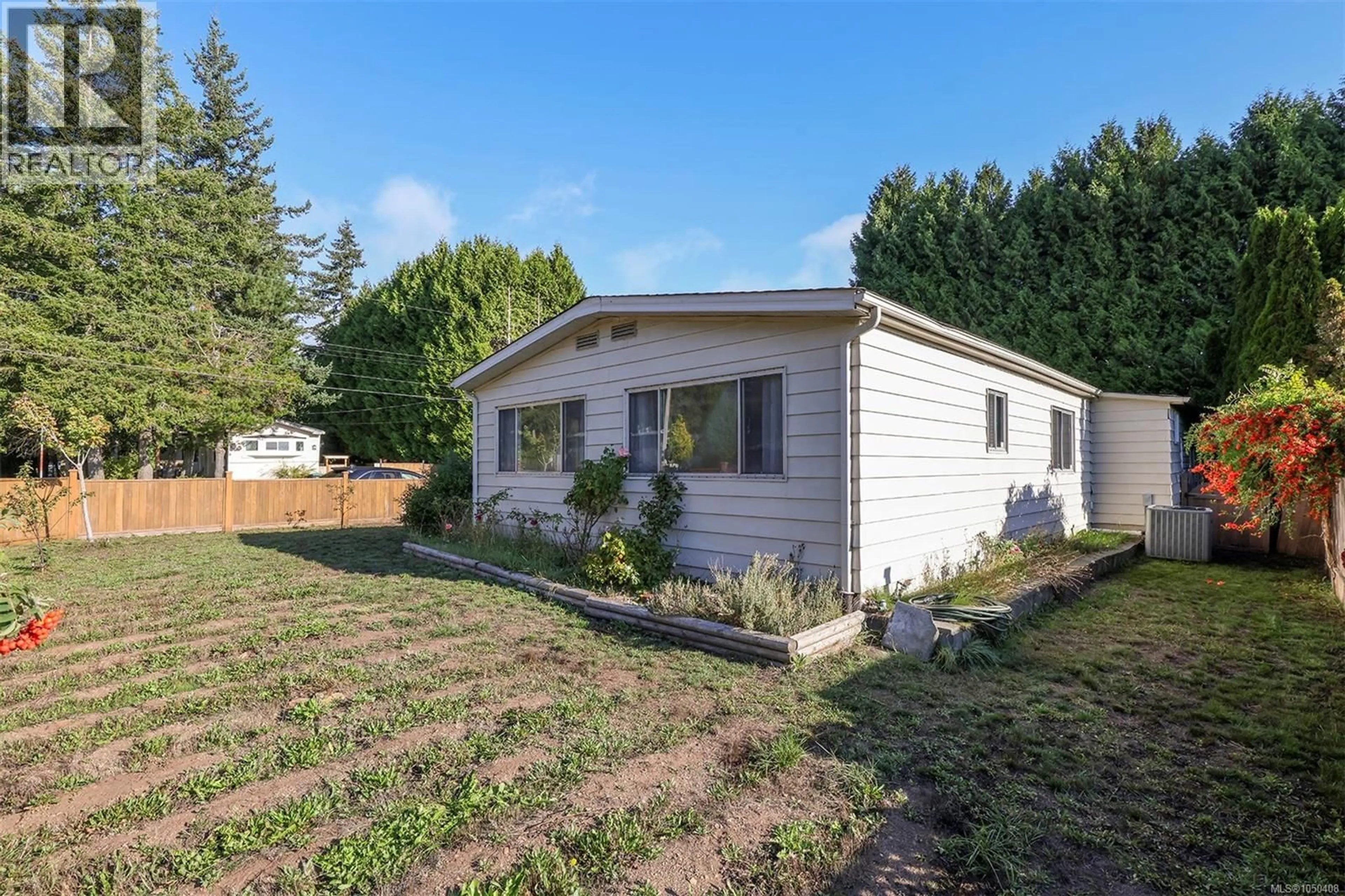 Home with vinyl exterior material, street for 2205 4TH STREET EAST, Courtenay British Columbia V9N7L9