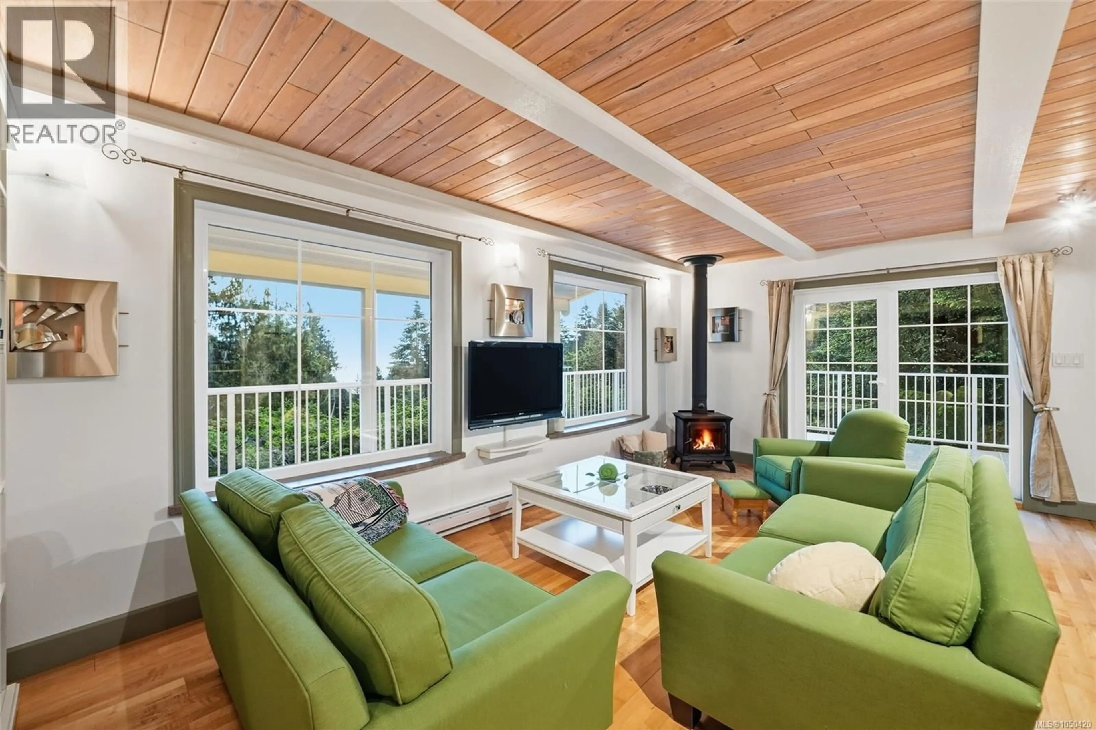 Living room with furniture, wood/laminate floor for 1973 HARLEQUIN CRESCENT, Nanoose Bay British Columbia V9P9J2