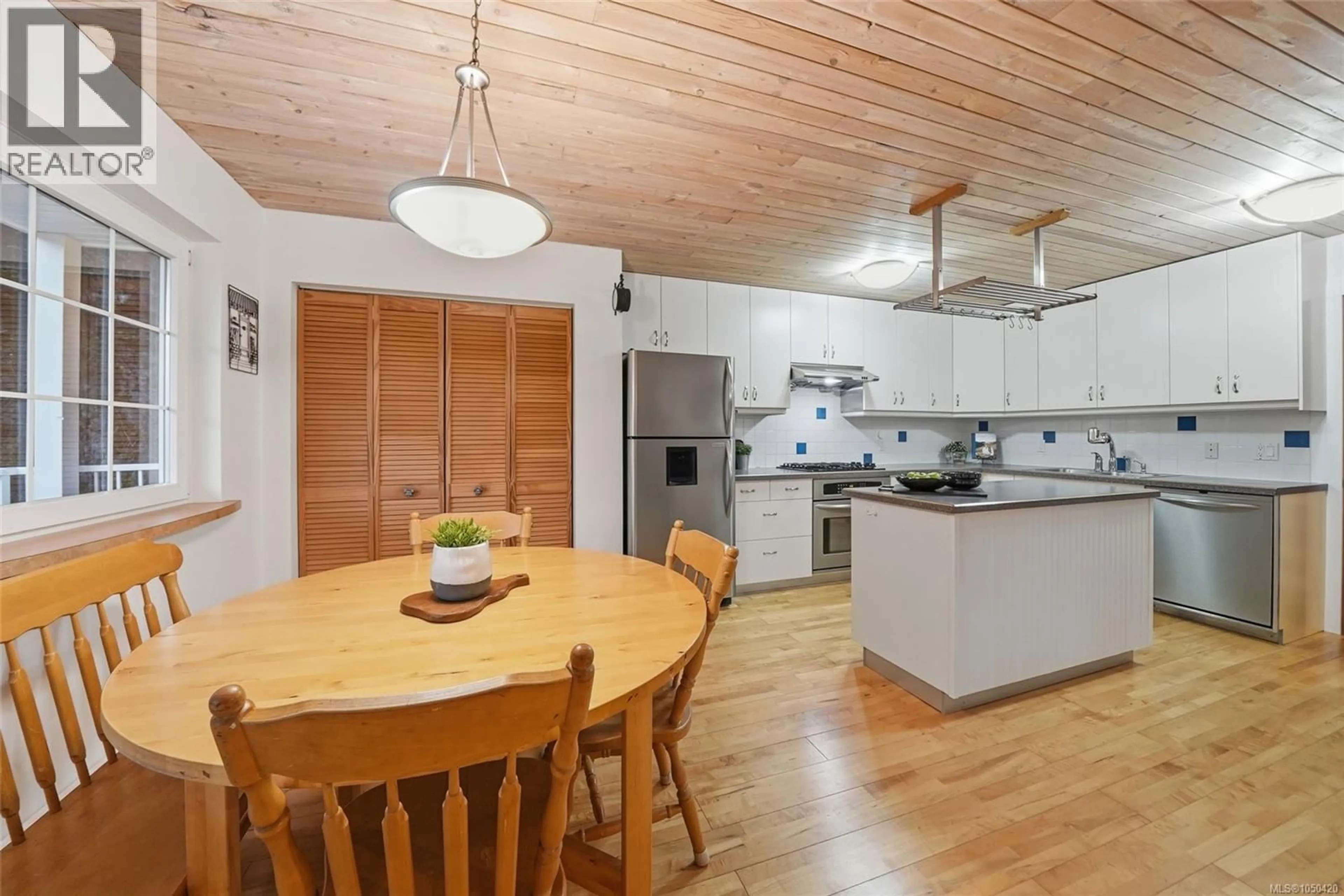 Open concept kitchen, wood/laminate floor for 1973 HARLEQUIN CRESCENT, Nanoose Bay British Columbia V9P9J2