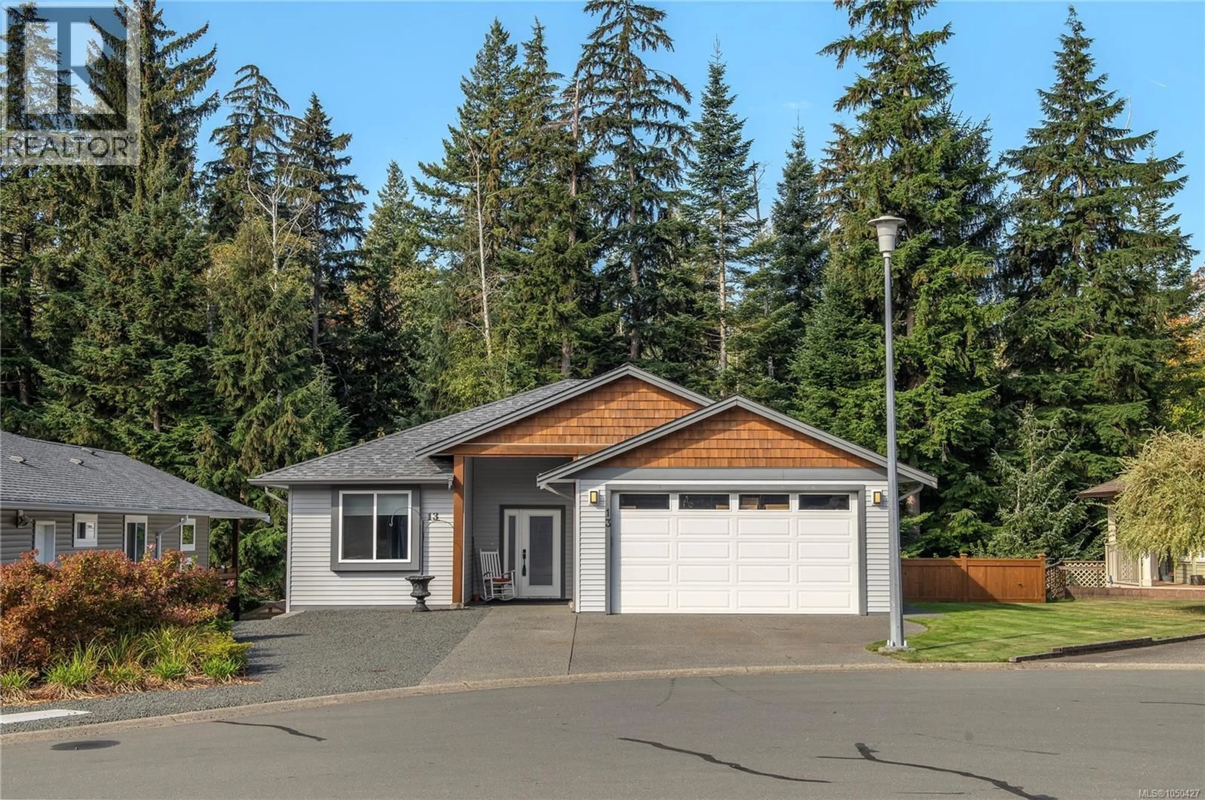 Home with vinyl exterior material, street for 13 - 100 MCPHEDRAN ROAD, Campbell River British Columbia V9W5P4