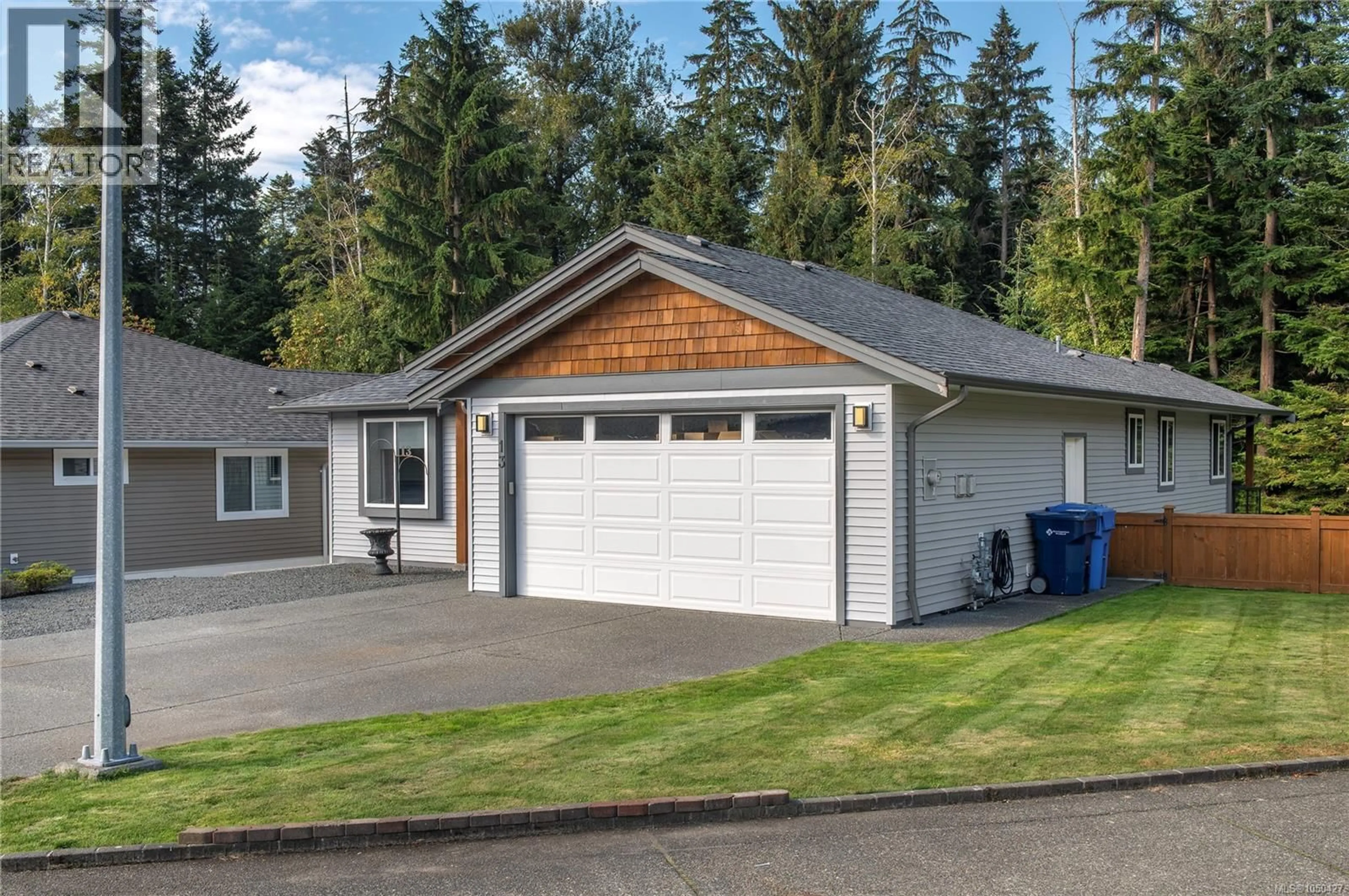 Home with vinyl exterior material, street for 13 - 100 MCPHEDRAN ROAD, Campbell River British Columbia V9W5P4