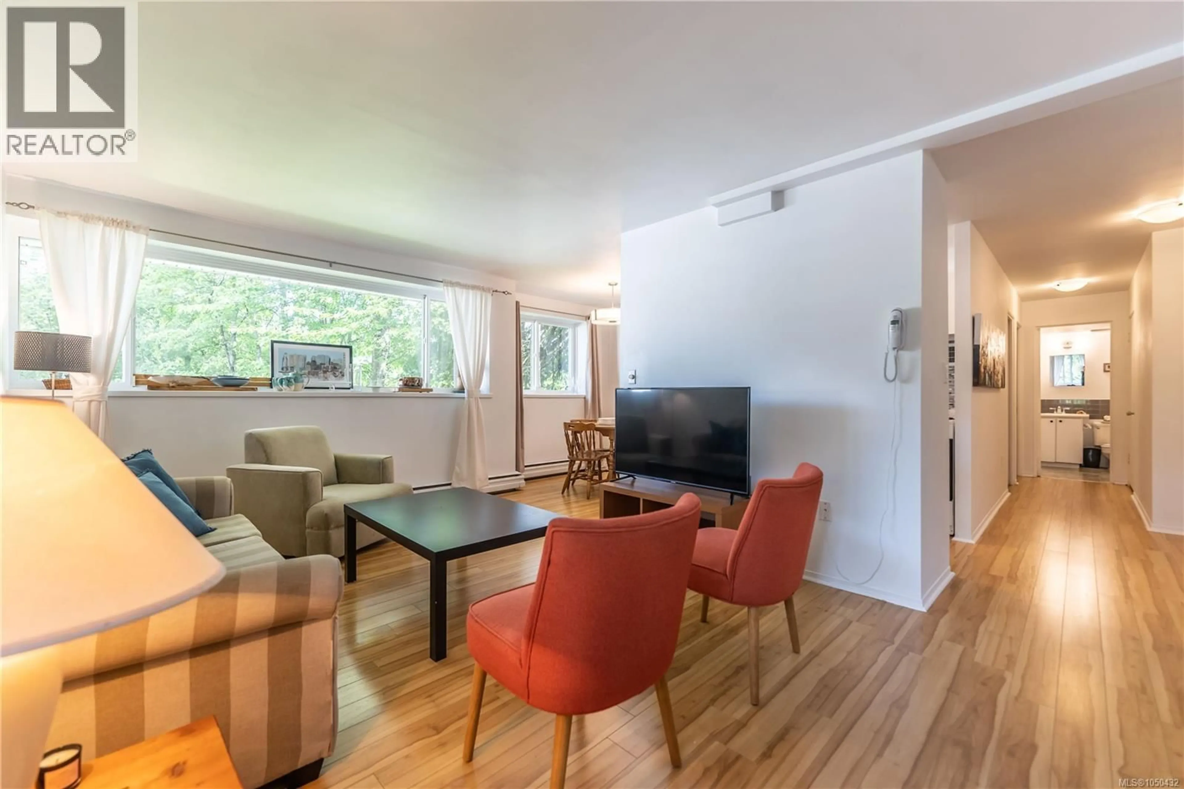 Living room with furniture, wood/laminate floor for 2107 - 1007 BOWEN ROAD, Nanaimo British Columbia V9R2A4