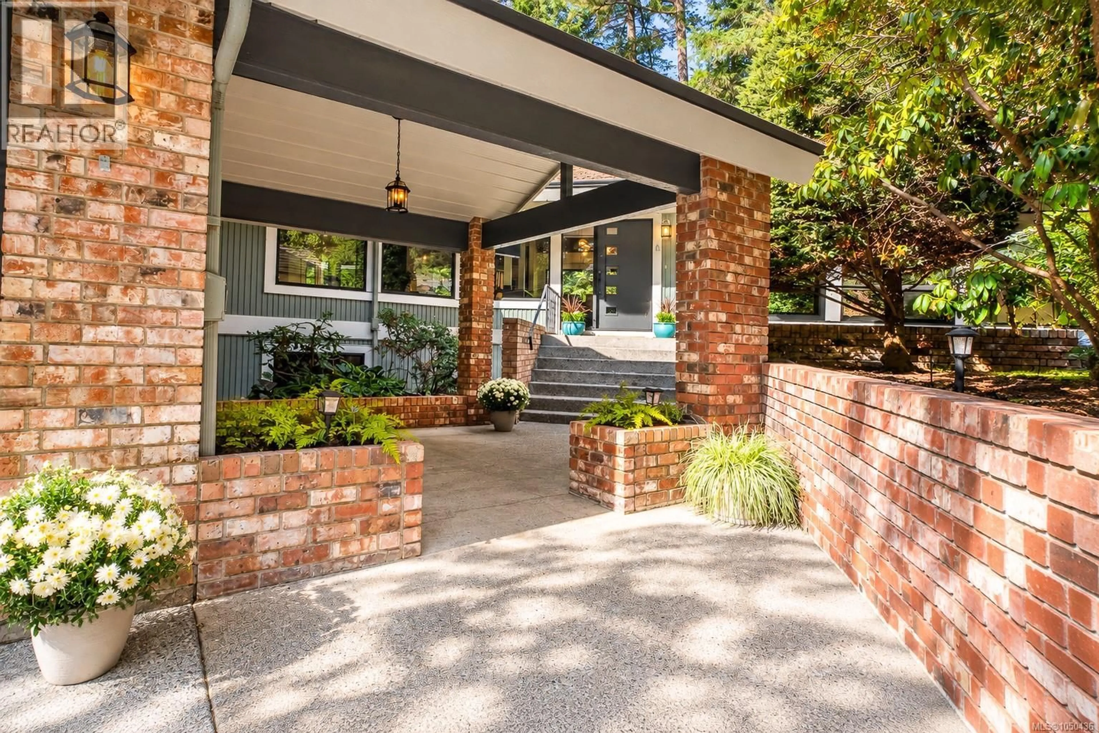 Home with brick exterior material, street for 973 WAGONWOOD PLACE, Saanich British Columbia V8X4M1