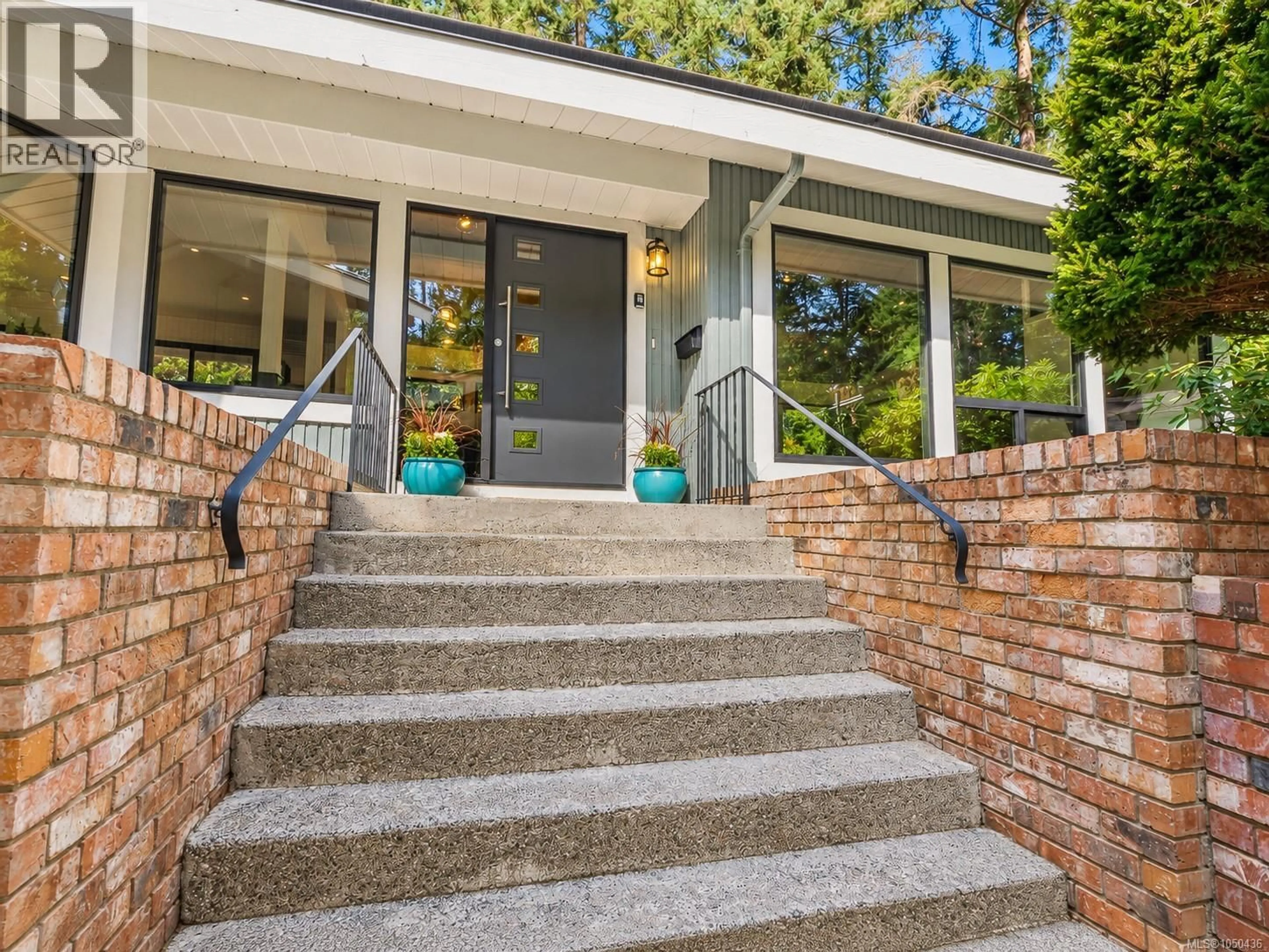 Home with brick exterior material, street for 973 WAGONWOOD PLACE, Saanich British Columbia V8X4M1