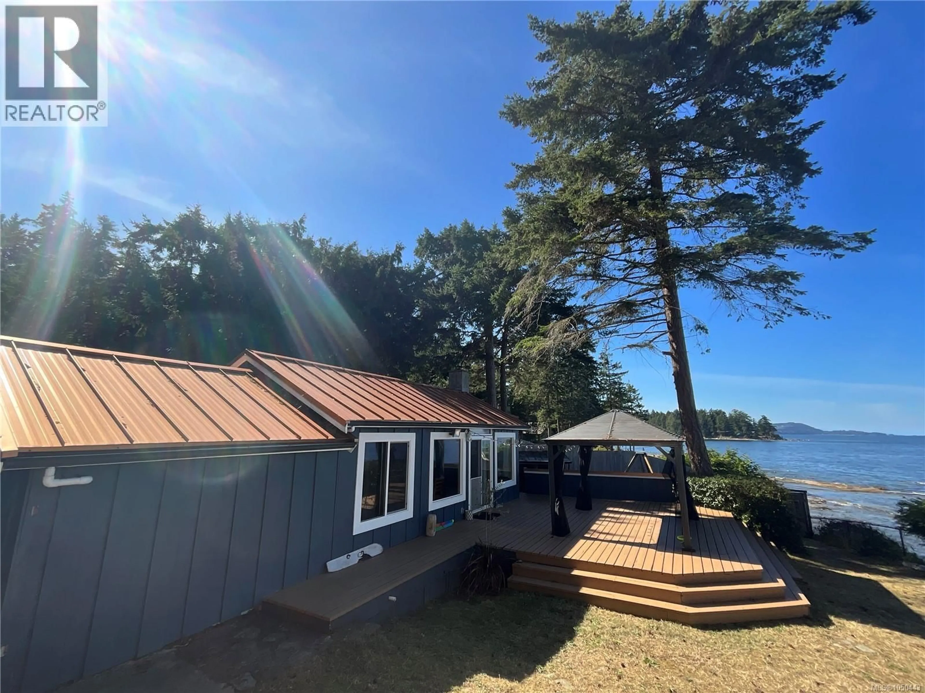 A pic from outside/outdoor area/front of a property/back of a property/a pic from drone, water/lake/river/ocean view for 532 BERRY POINT ROAD, Gabriola Island British Columbia V0R1X1