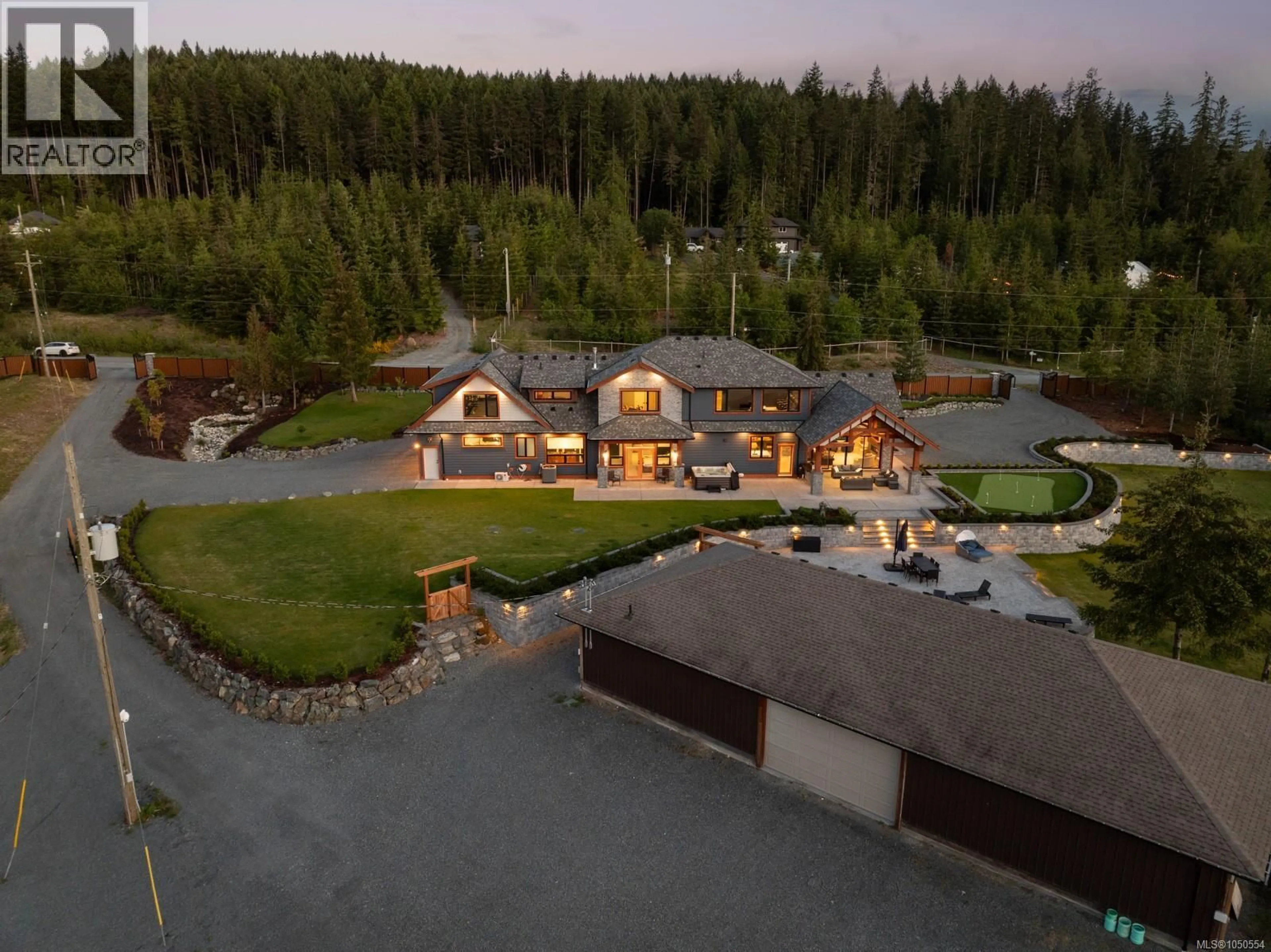 A pic from outside/outdoor area/front of a property/back of a property/a pic from drone, mountain view for 2833 WOODCROFT PLACE, Shawnigan Lake British Columbia V8H2E4