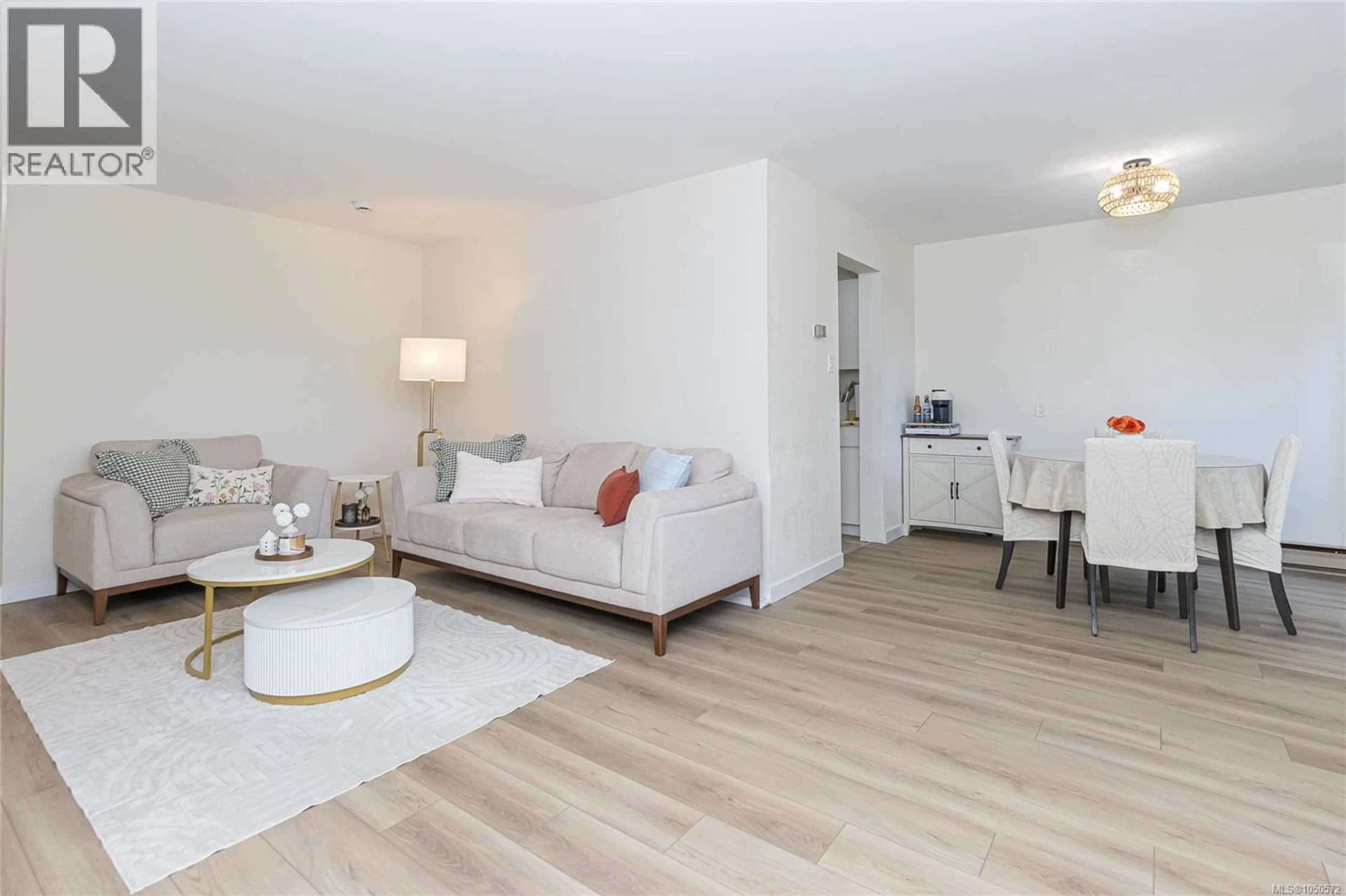 Living room with furniture, wood/laminate floor for 43 - 840 CRAIGFLOWER ROAD, Esquimalt British Columbia V9A2X1
