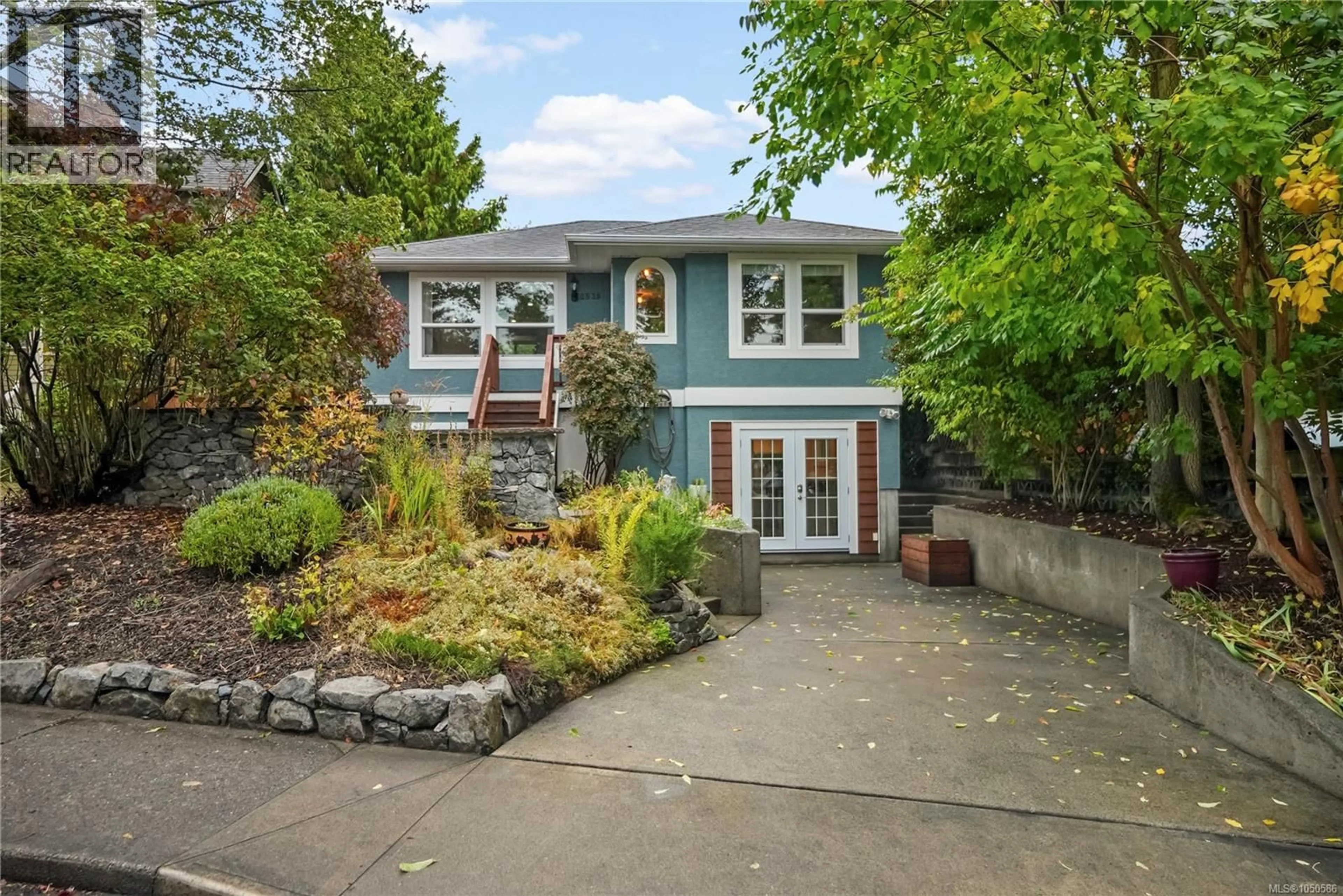 Home with vinyl exterior material, street for 2539 CEDAR HILL ROAD, Victoria British Columbia V8T3G8
