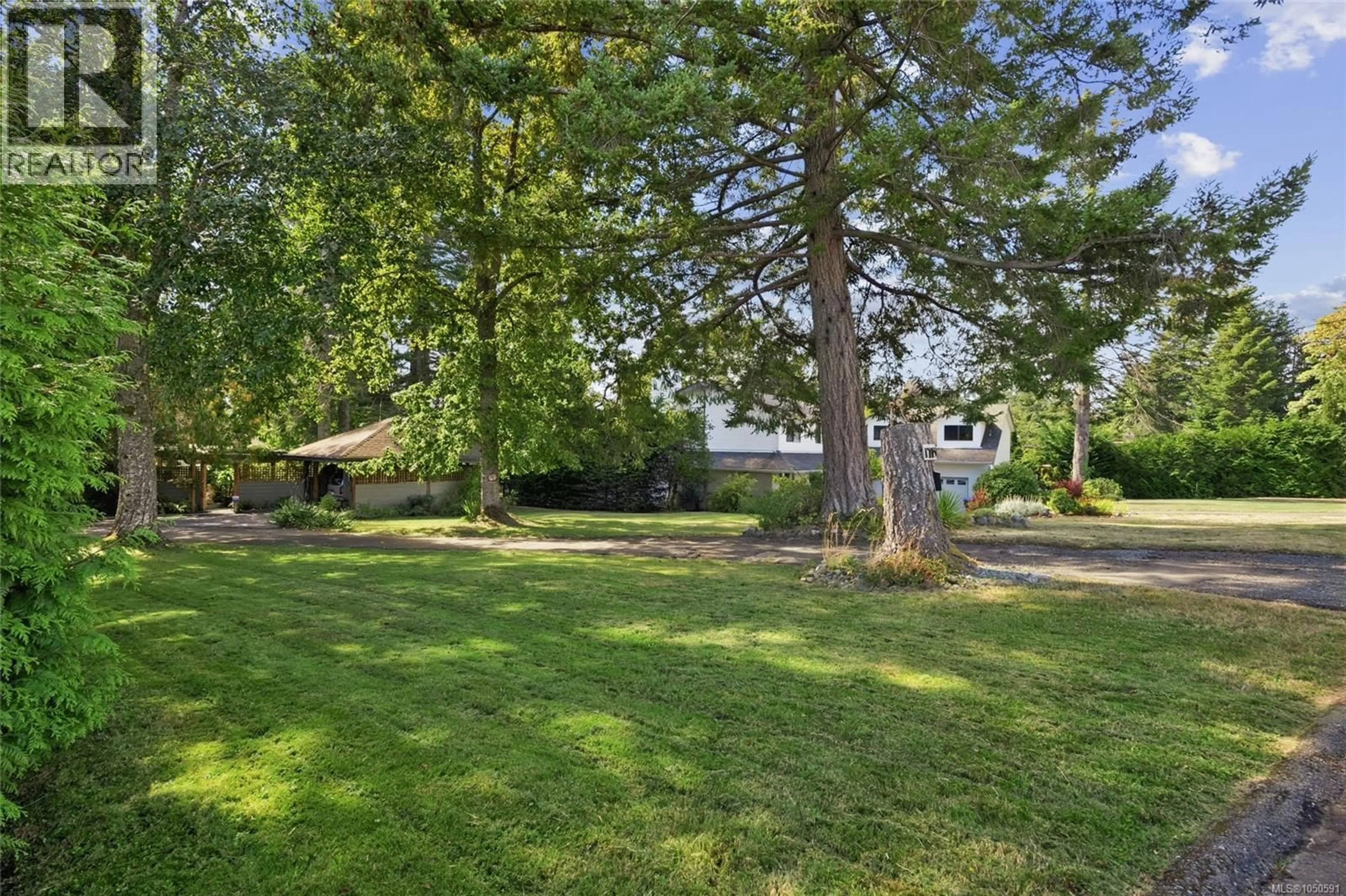 A pic from outside/outdoor area/front of a property/back of a property/a pic from drone, street for 1719 CENTENNIAL AVENUE EAST, Comox British Columbia V9M2W3