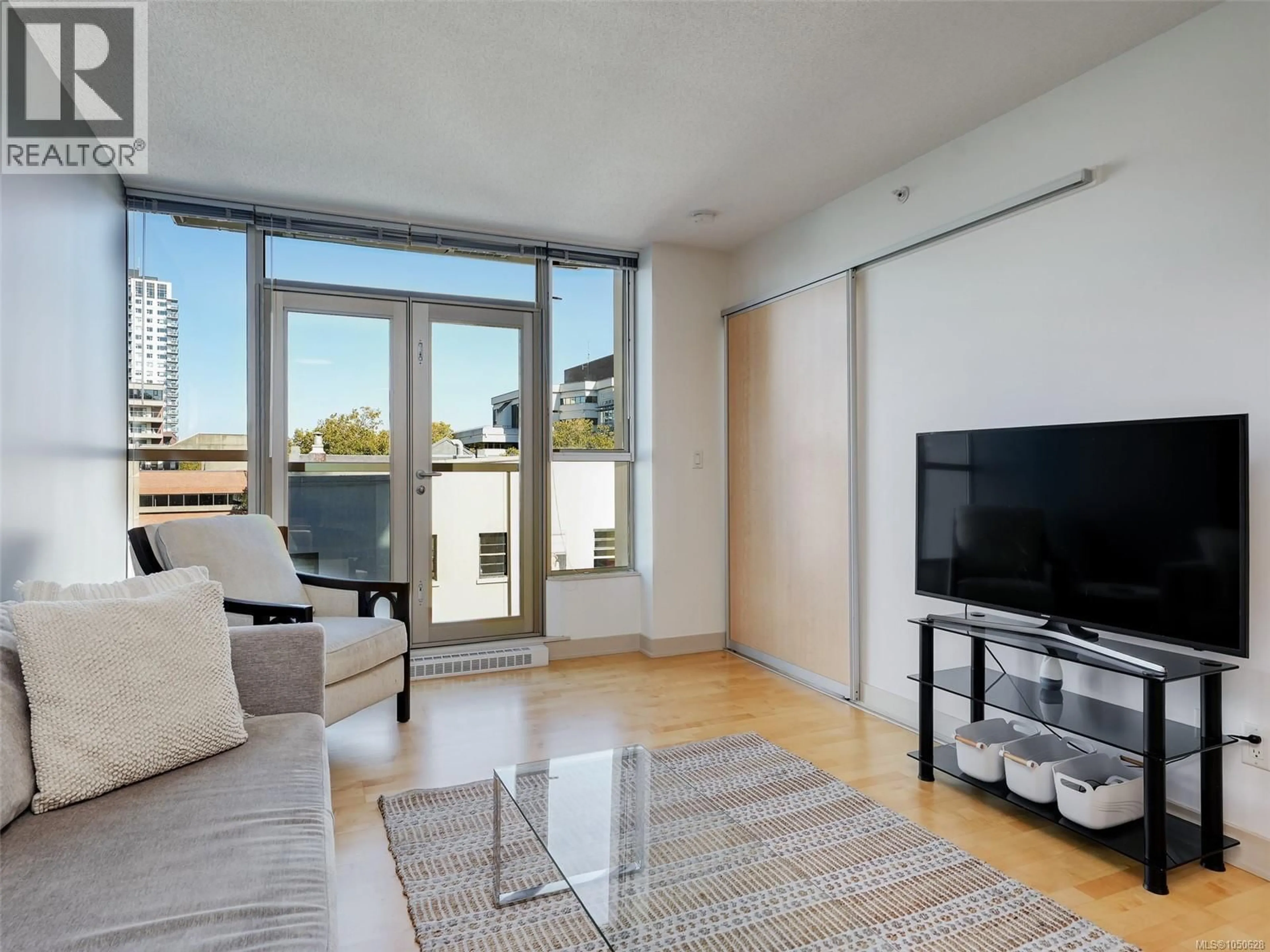 Living room with furniture, unknown for 505 - 760 JOHNSON STREET, Victoria British Columbia V8W0A4