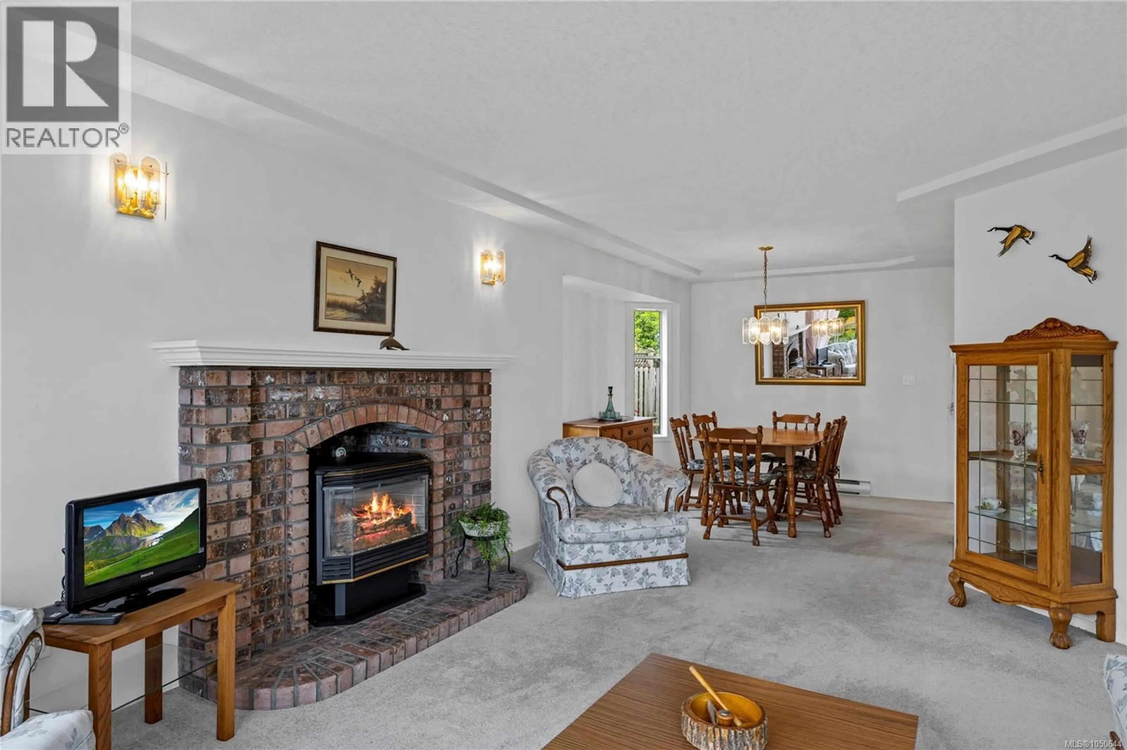 Living room with furniture, unknown for 464 QUATSINO ROAD, Qualicum Beach British Columbia V9K1B5