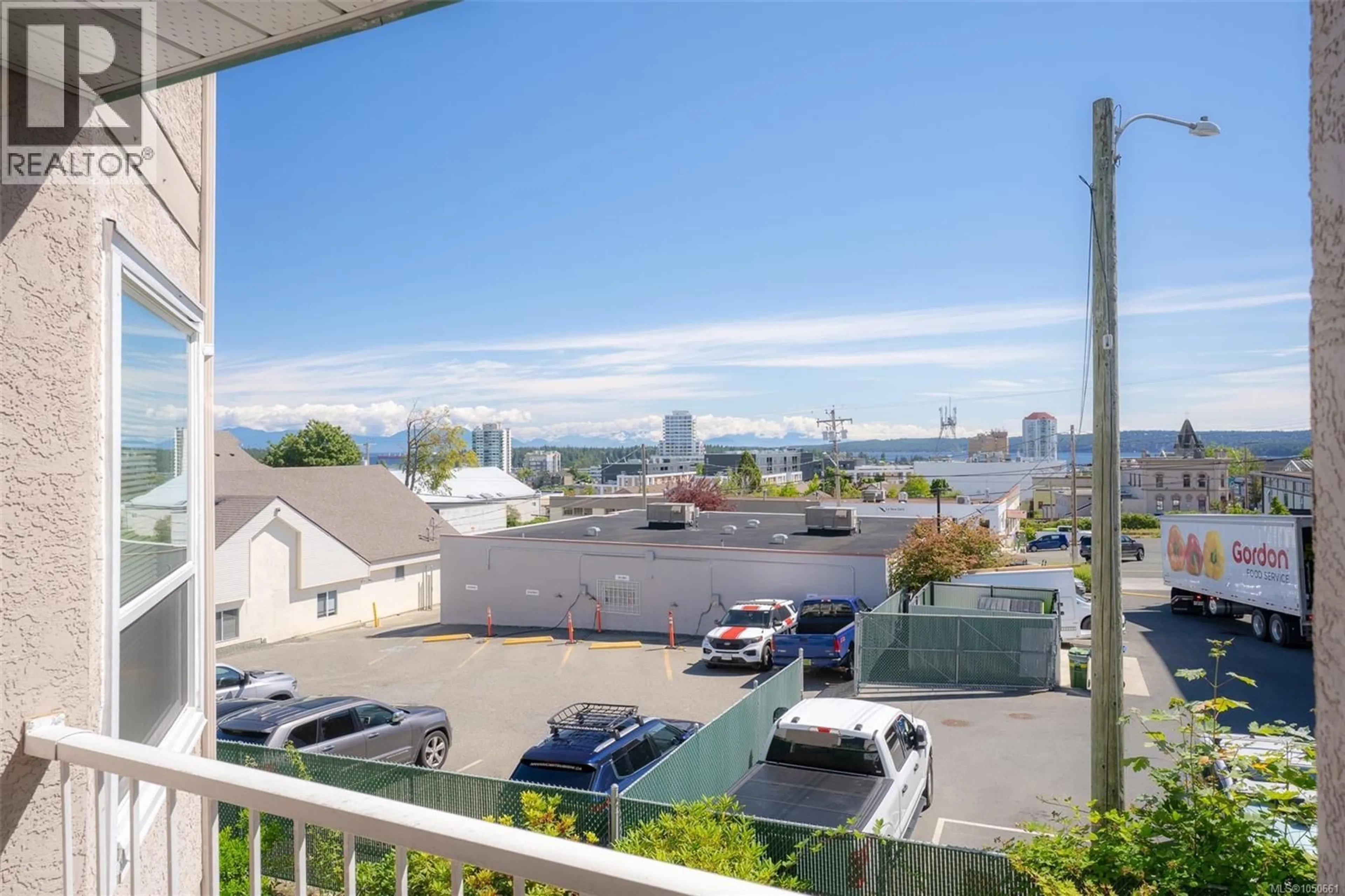 Patio, city buildings view from balcony for 305 - 240 MILTON STREET, Nanaimo British Columbia V9R2K6